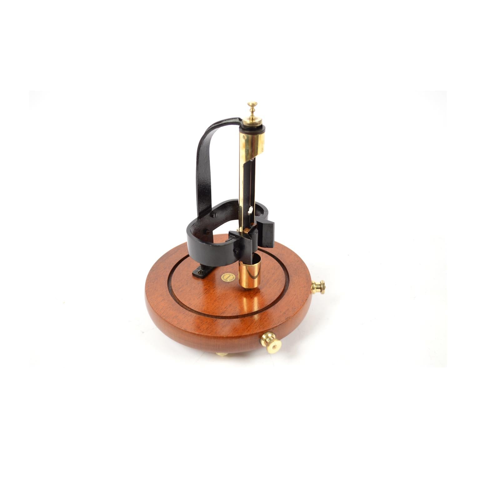 Brass galvanometer with glass dome and wooden base with 3-screw base, instrument signed Philip Harris Ltd Birmingham England n. 19402, made in the 1887 circa, a tool used as a detector of direct current and of very weak intensities. Very good