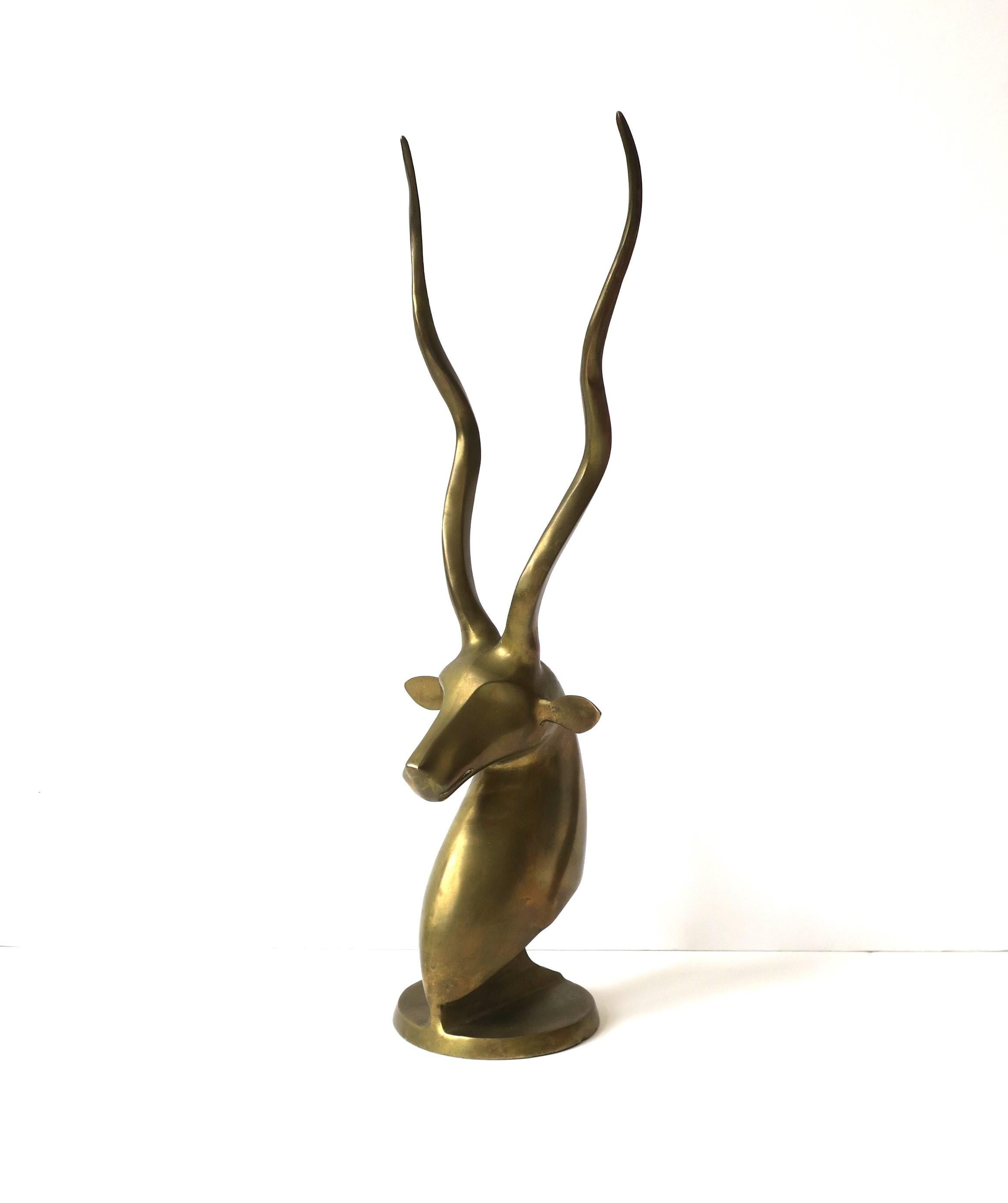 A brass animal Gazelle antelope bust sculpture decorative object with tall antlers, circa late-20th century, 1970s. Dimensions: 21.5