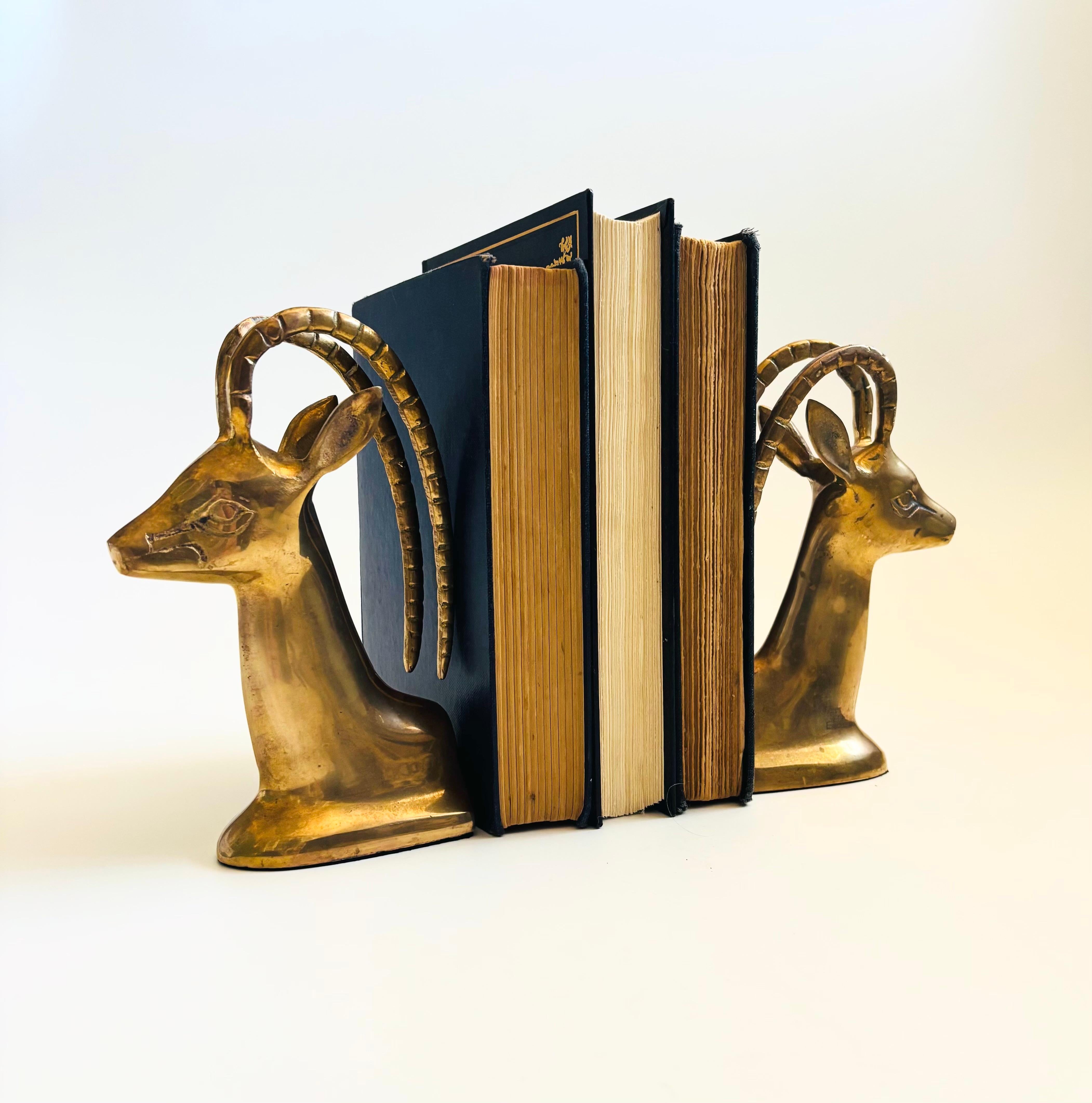 A pair of vintage brass bookends in the shape of gazelles. Beautiful gold coloring to the brass.

