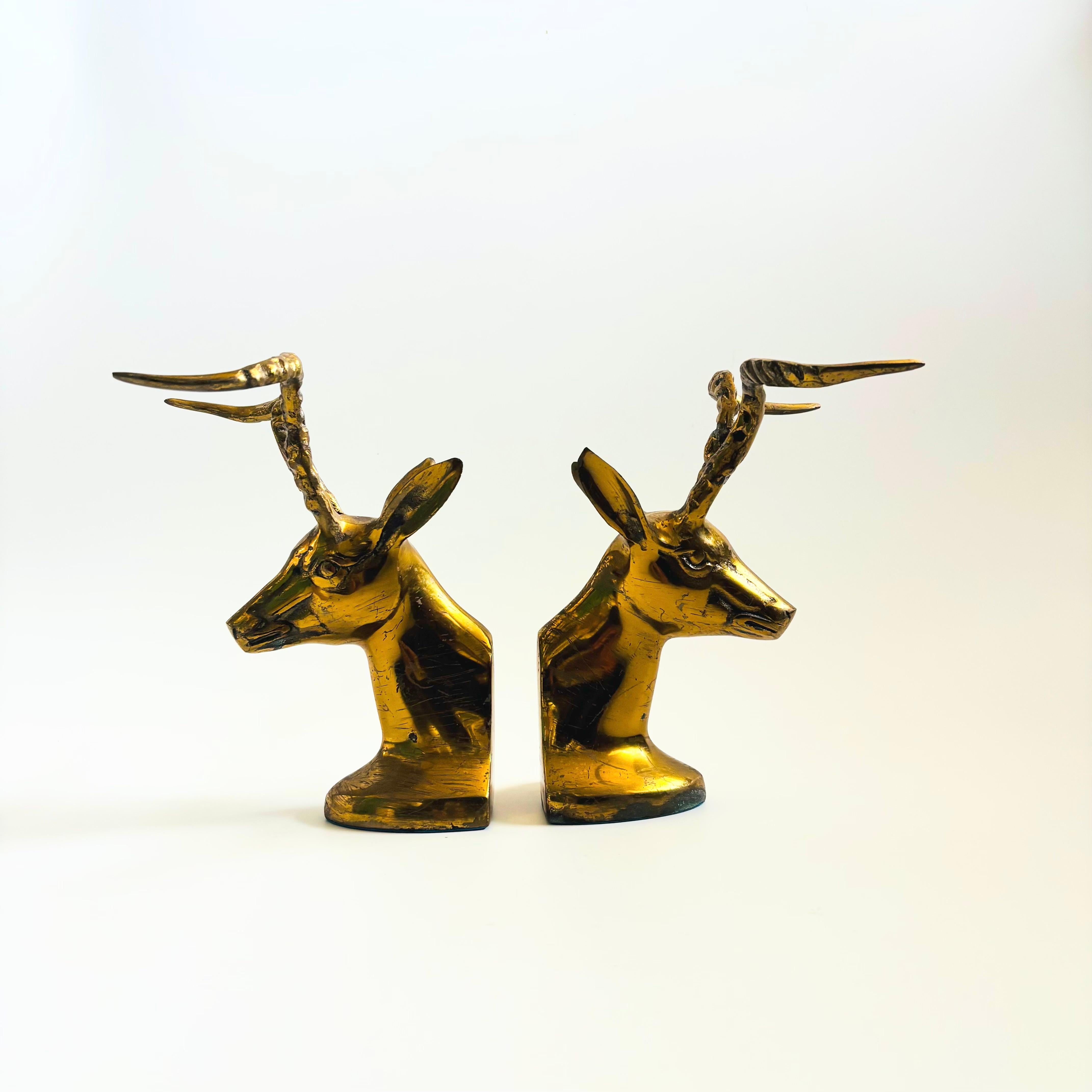 A pair of vintage brass bookends in the shape of gazelles. Beautiful gold coloring to the brass. Nice larger size with dramatic horns. Made in Korea.

