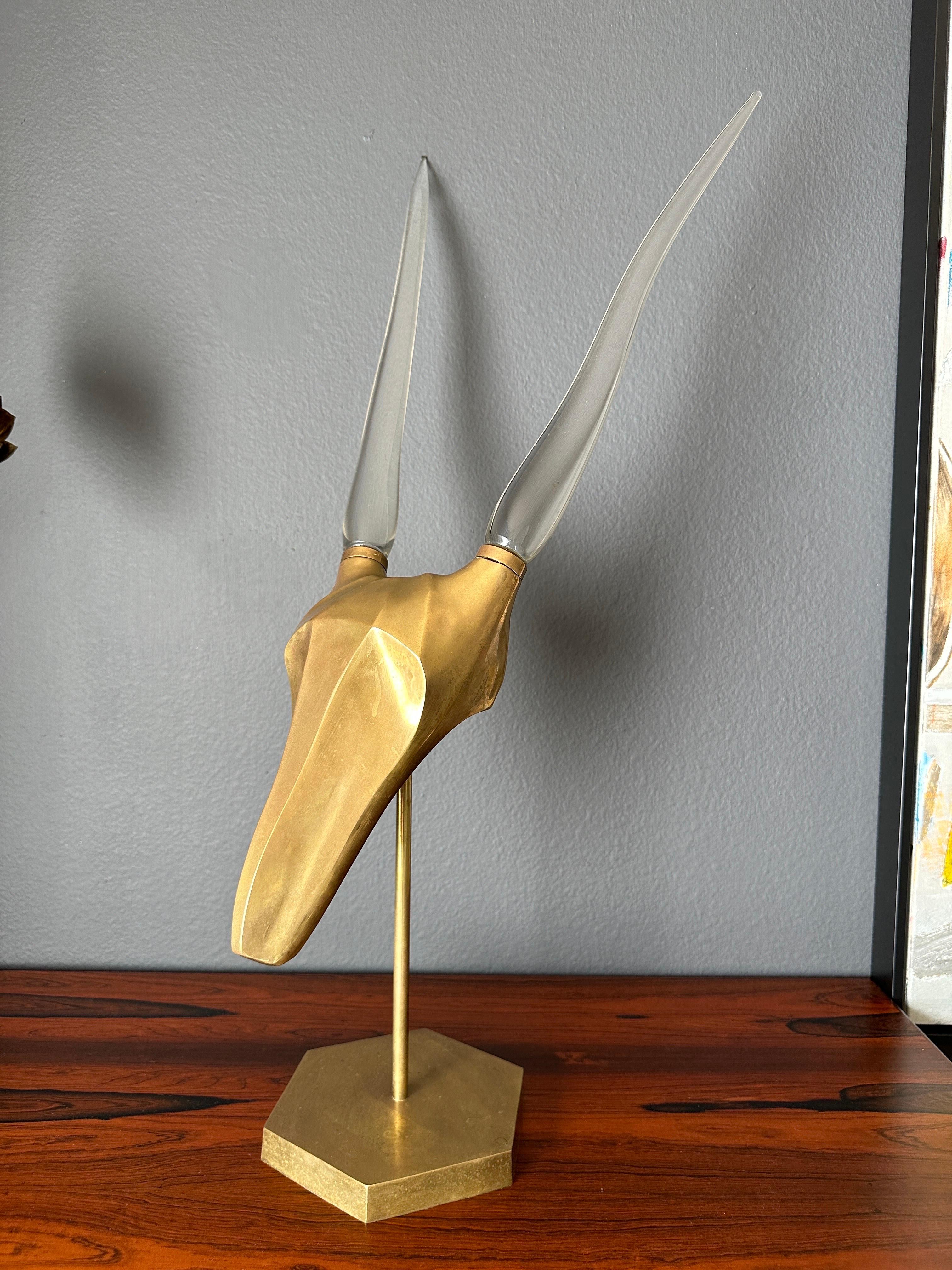Patinated brass gazelle / antelope sculpture with cast glass horns in the manner of Karl Springer.