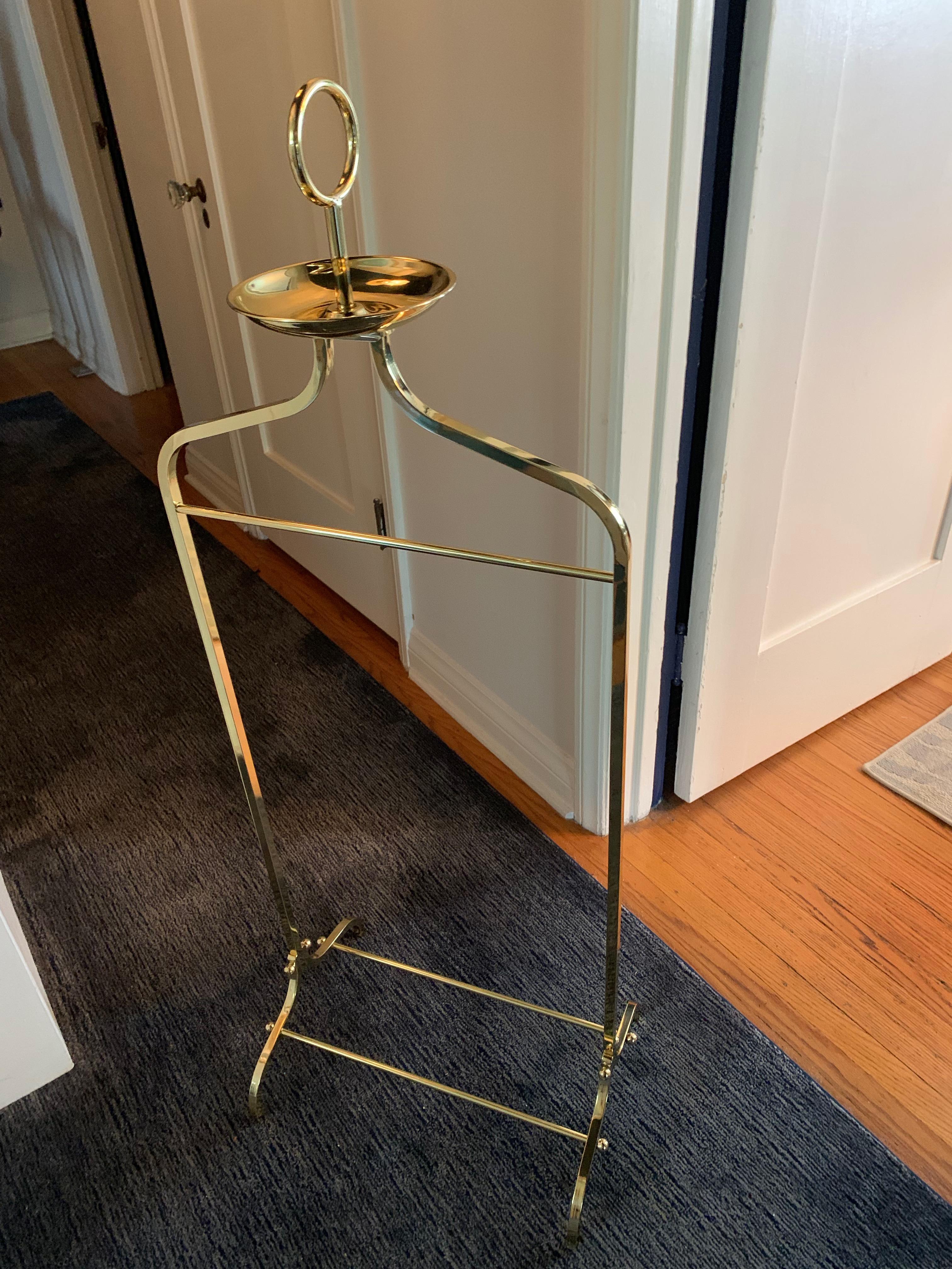 Gentleman's Valet designed by Charles Hollis Jones for Desi Arnaz (Lucille Ball's famed first Husband). 

This handsome piece is perfect for traditional to highly modern decor. The substantial brass construction is a wonderful piece to store your