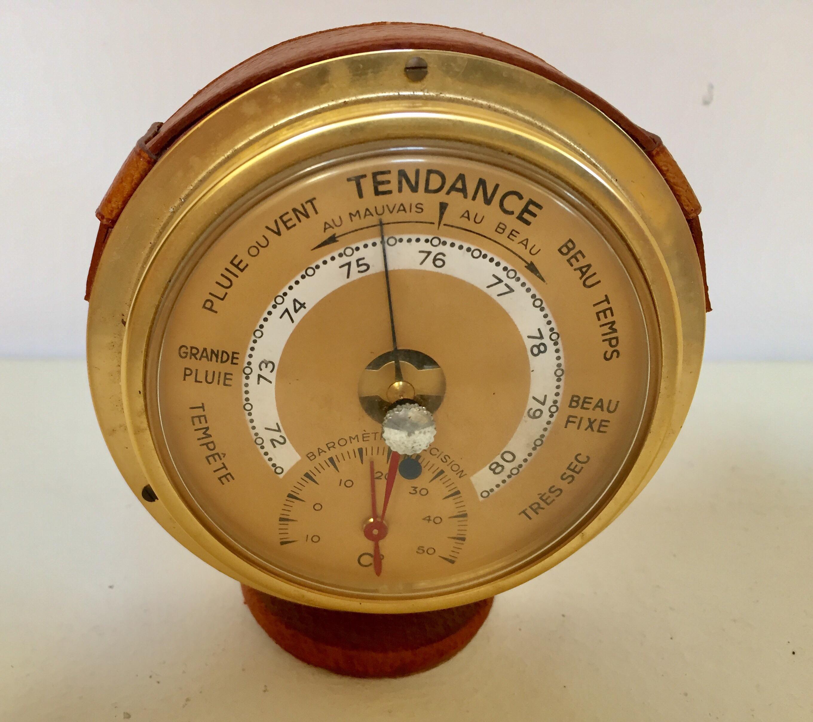 Polished brass French barometer with readings in English.
Wrapped in a brown leather strap.
Great patina on leather in Jacques Adnet style.
Made in France.
Dimensions: 4