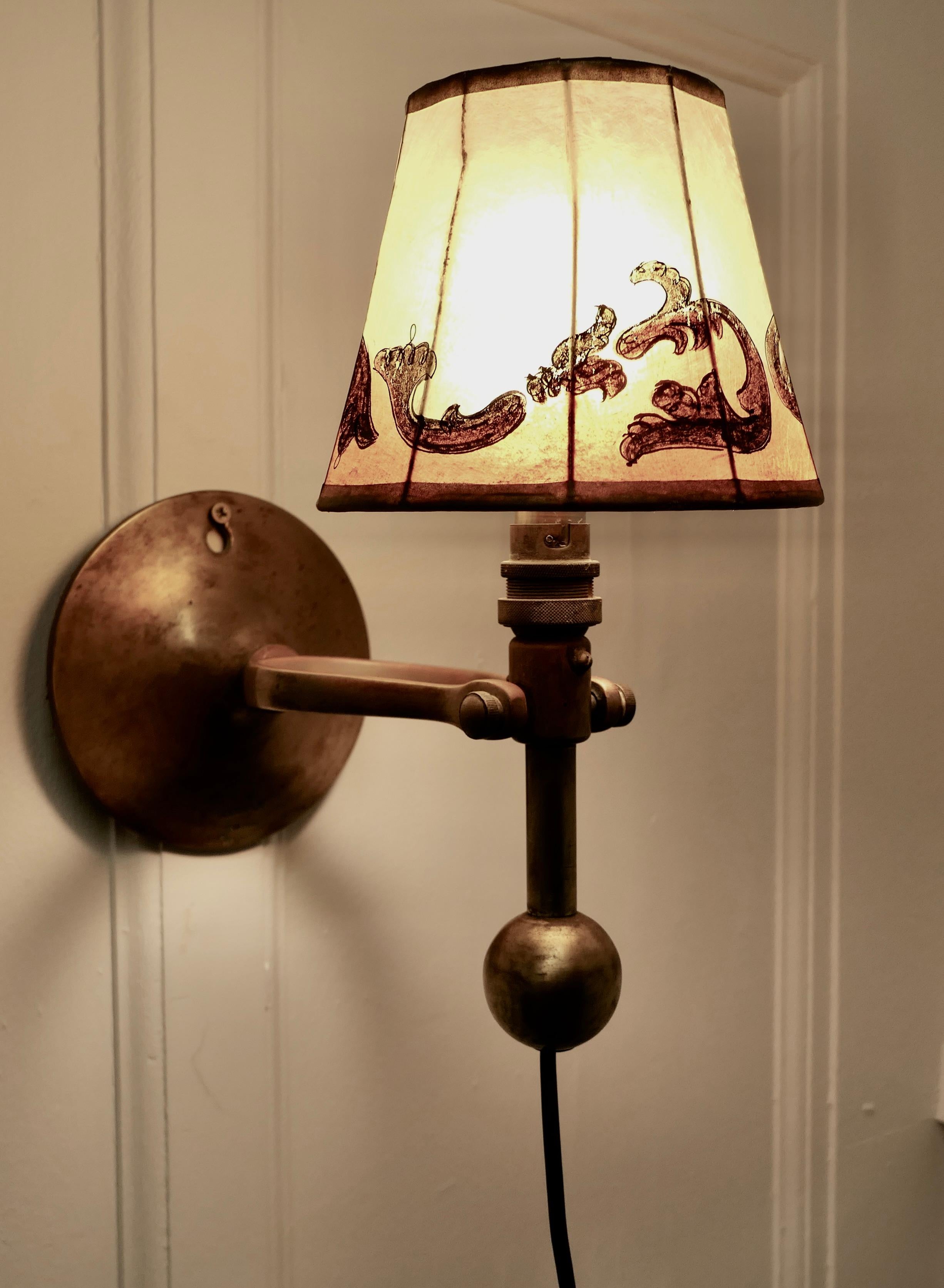 Brass Gimbal Ships Lamp, Wall Hung or Table Lamp

This is a very attractive piece, the lamp originated from a boat, it has a gimbal action which when the boat sways from time to time the it will remain upright.
This heavy lamp works well as a