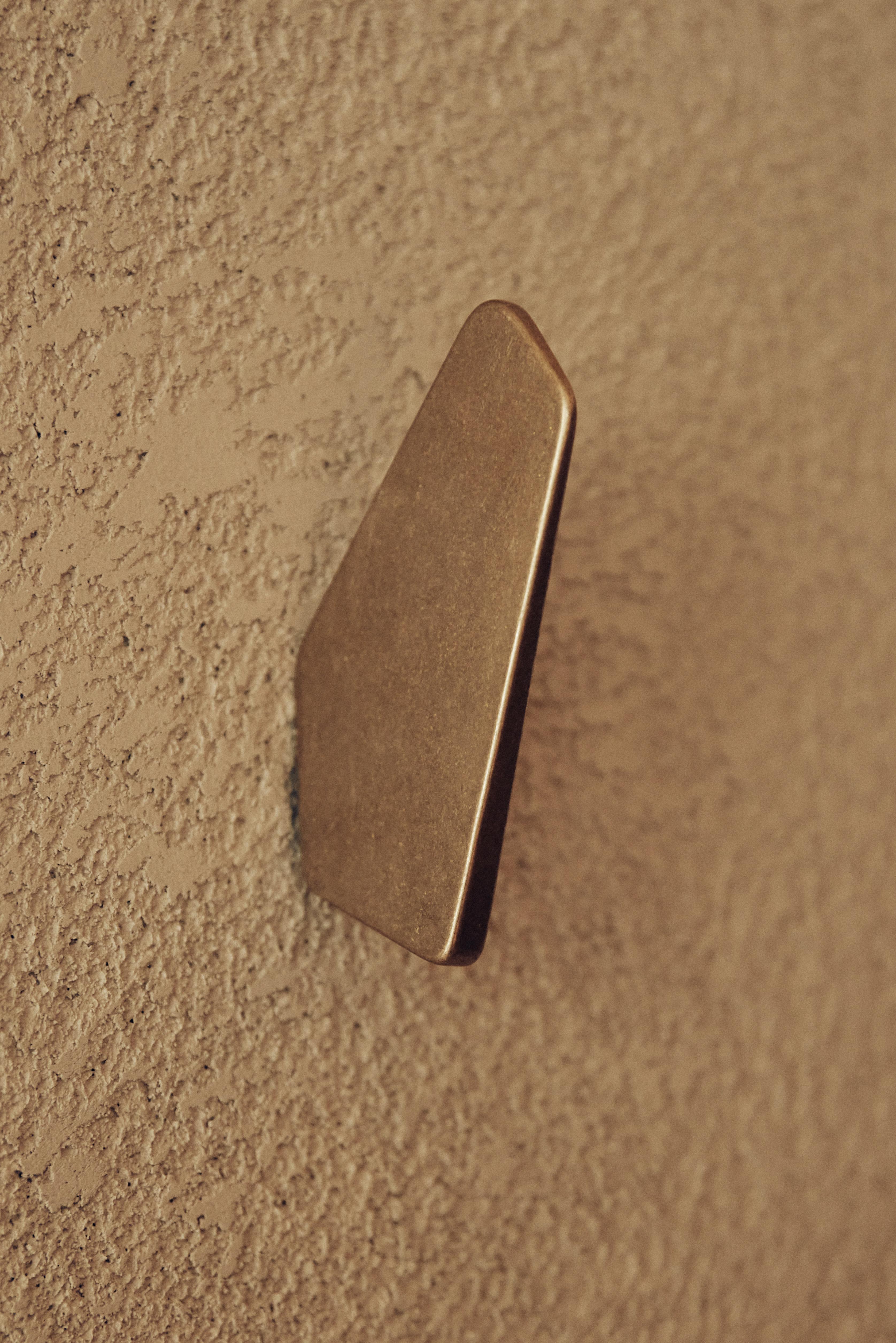 Brass Gio Hook by Henry Wilson
Dimensions: W 2 x D 8 x H 12 cm
Materials: Brass
Note: Hooks come with matching screws.

The Gio Hook is sand cast in solid brass. Named after Signor Ponti, forever an inspiration.

Our Hooks are manufactured in small