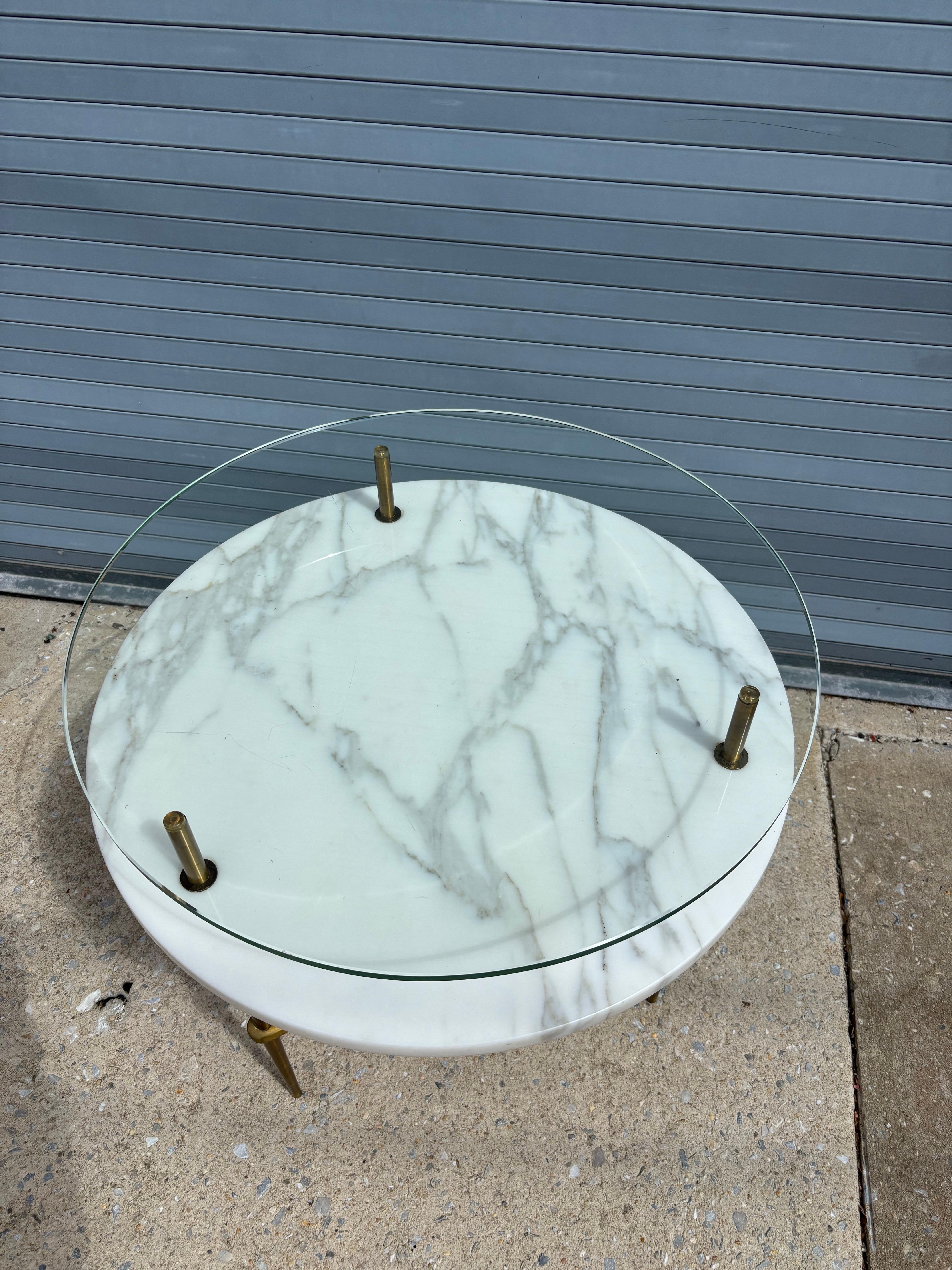 Round Glass, Marble and Brass Side Table.  Shows styling associated with Italian Design and often said to be Italian?!  Has a great look, and table sits very soild!  Bottom shelf is 19.5