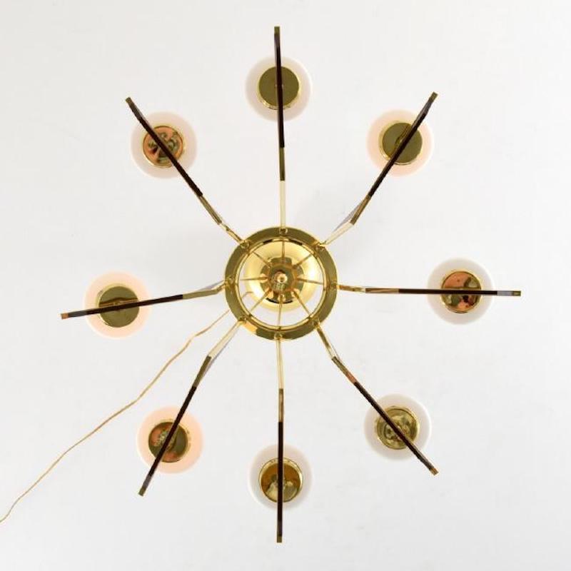 Gorgeous Stilnovo Attributed chandelier in teak, brass and glass. Made in Italy, circa 1958.

Glass Globes 10.5