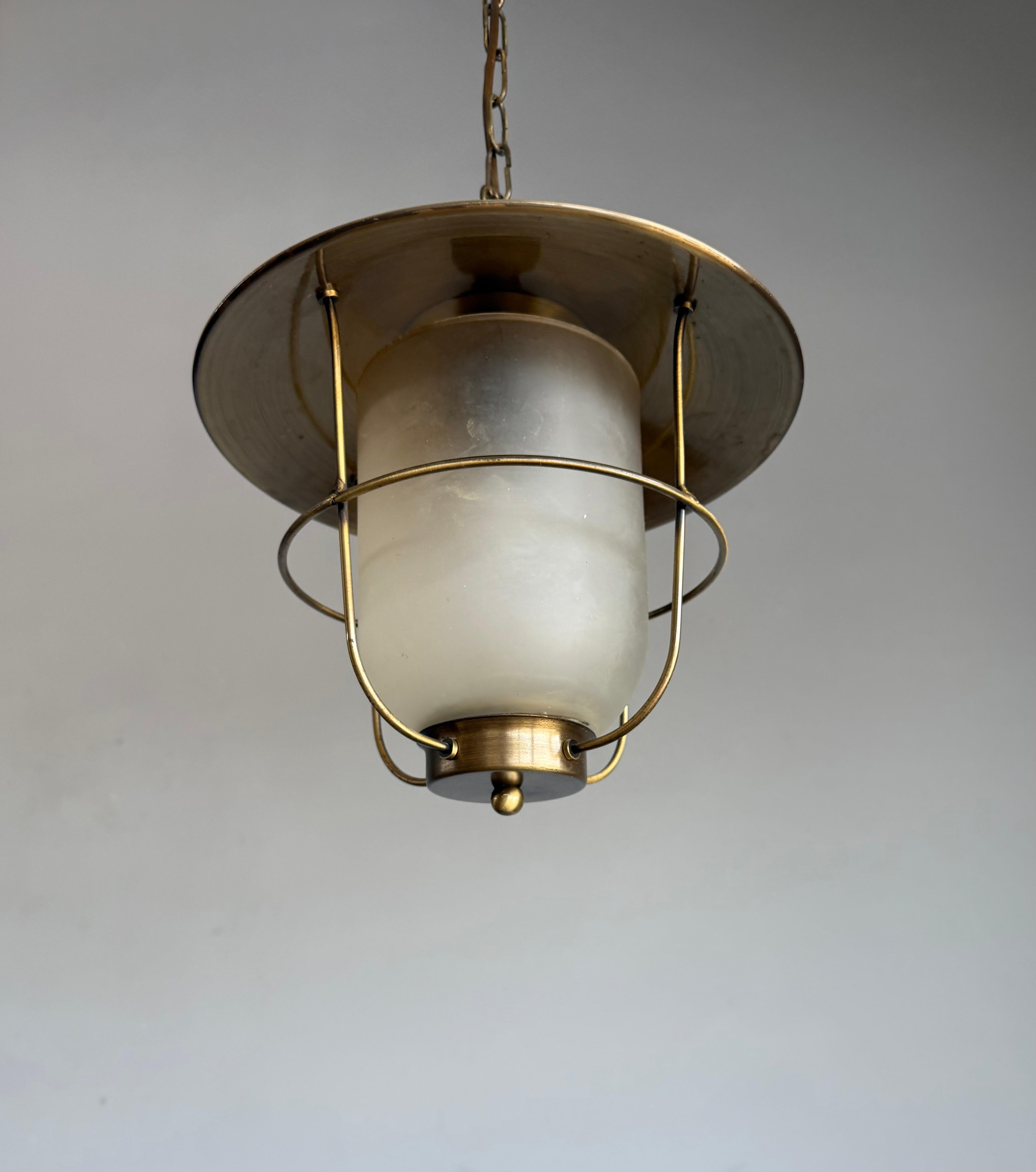 1980s brass and glass pendant light with a maritime soul and modernist edge. A rare lantern-inspired design that casts a warm, atmospheric glow,  perfect as a statement in lofts, coastal homes, or contemporary interiors.

A pendant light with real