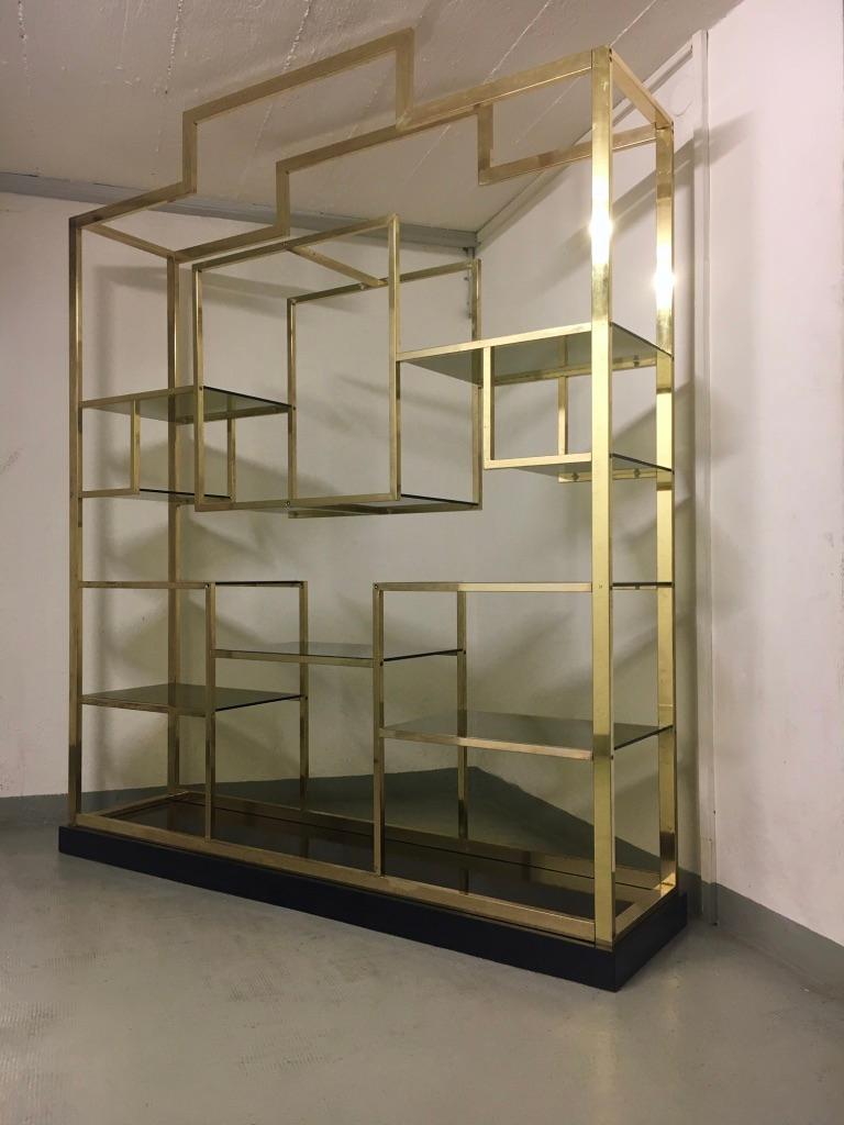 Brass, glass and black lacquered base shelving by Romeo Rega, Italy ca. 1970s
Measures: H 220 x L 180 x D 42 cm
Good vintage condition, few little chips on a couple of glass shelves, invisible.
Entirely dismountable for shipping.

 