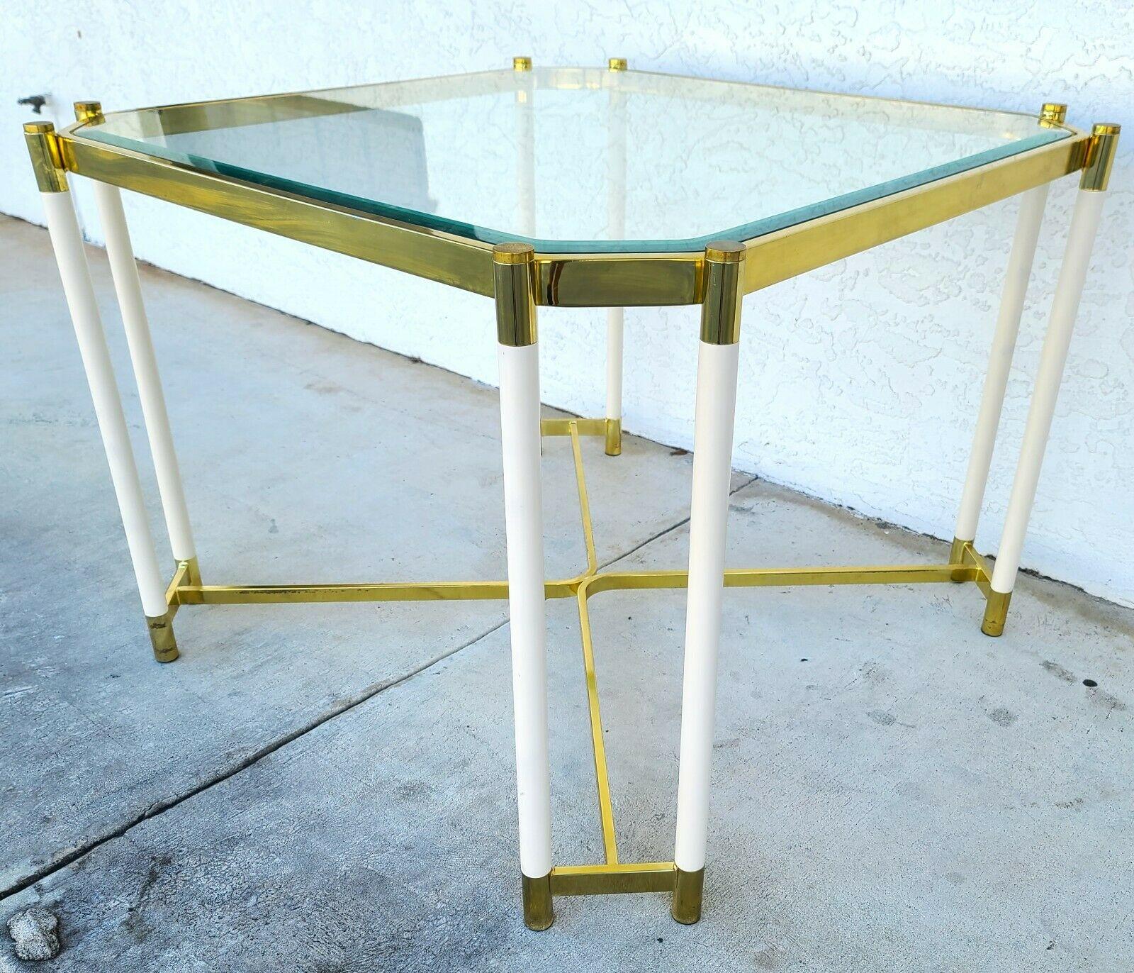 Offering one of our recent palm beach estate fine furniture acquisitions of a brass & glass dining game table by Design Institute of America (DIA)
We originally listed this with Milo Baughman as the designer but have since determined that we can't