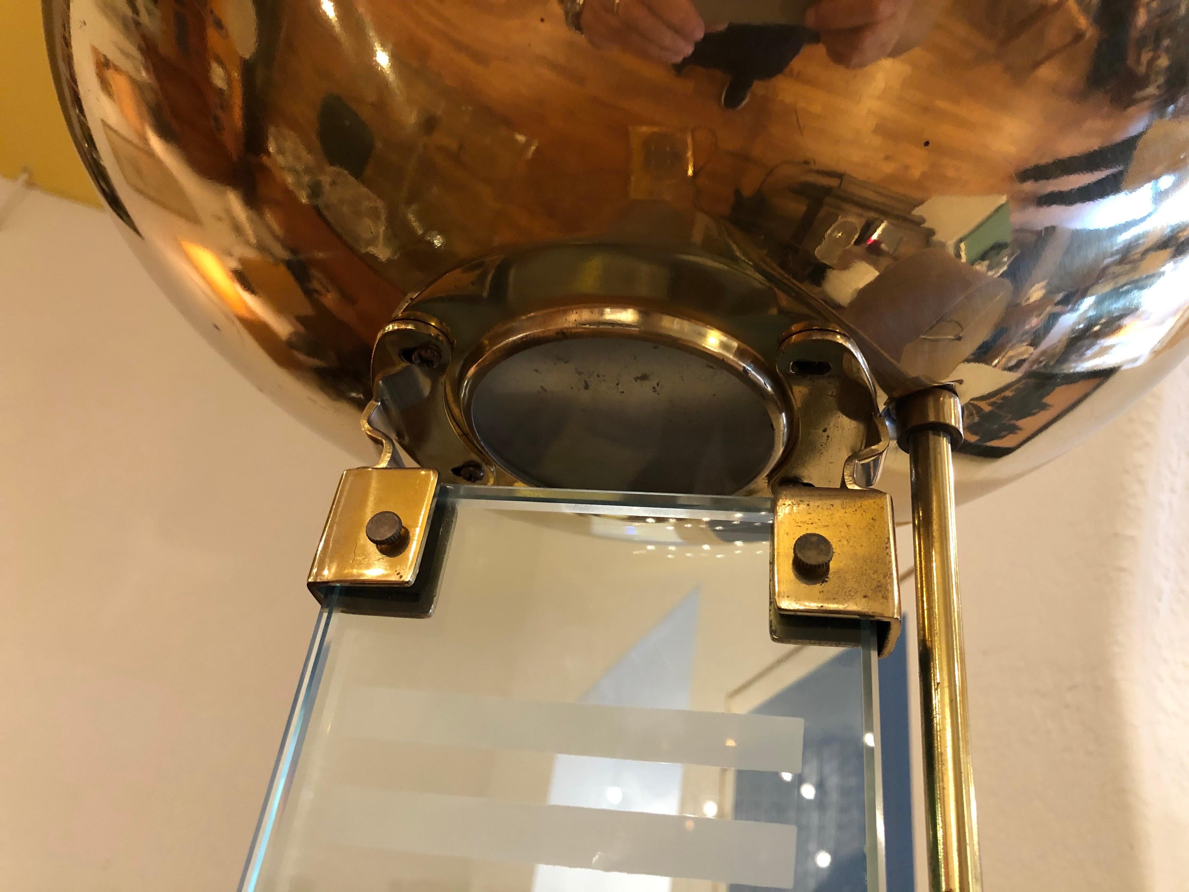 Beautiful brass floor lamp, with glass stem and brass uplight, frosted glass design in the middle of the glass, we have polished a little the base and left some patina, the lamp comes with a dimmer switch it's in perfect working condition, circa