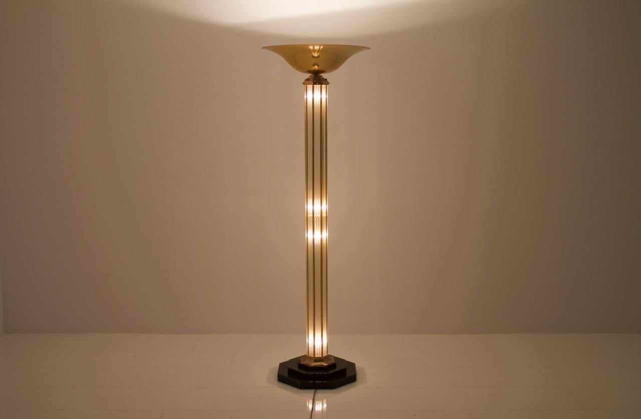 Signed halogen floor lamp in brass and glass, France 1970s.
Very good condition.