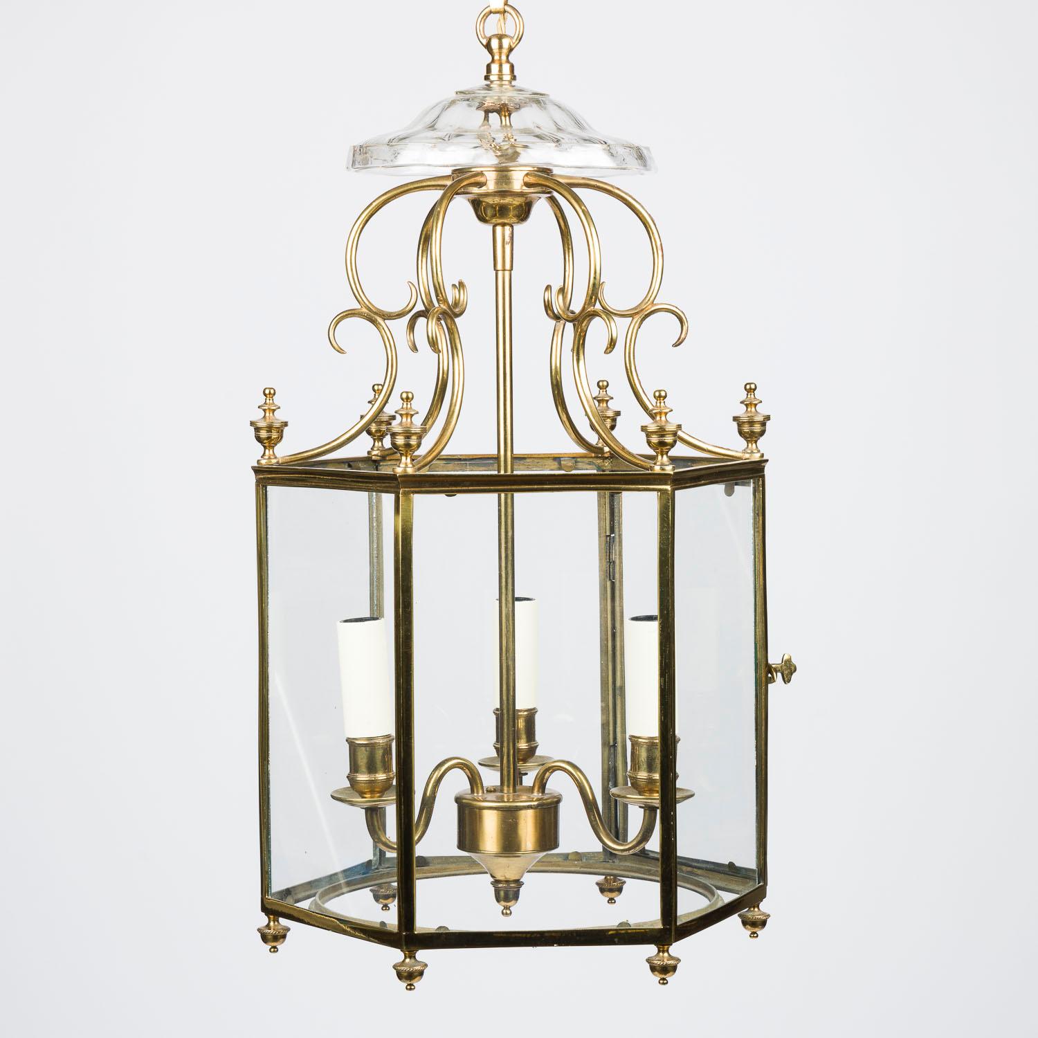 A small scale mid 20th century brass and glass hexagonal hall lantern, in the Regency style.

With 3 internal lights, with hinged door.

Re-wired and tested.