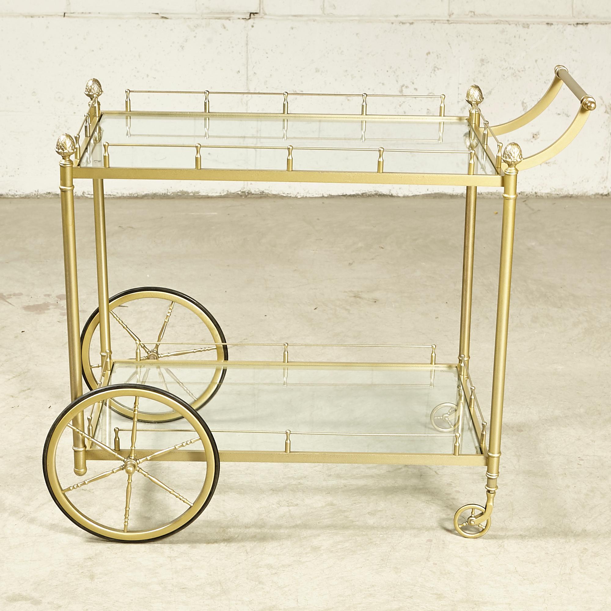 Vintage 1960s brass and glass rolling serving/bar cart with pineapple accents. The cart is in newly refinished condition. No maker's mark.