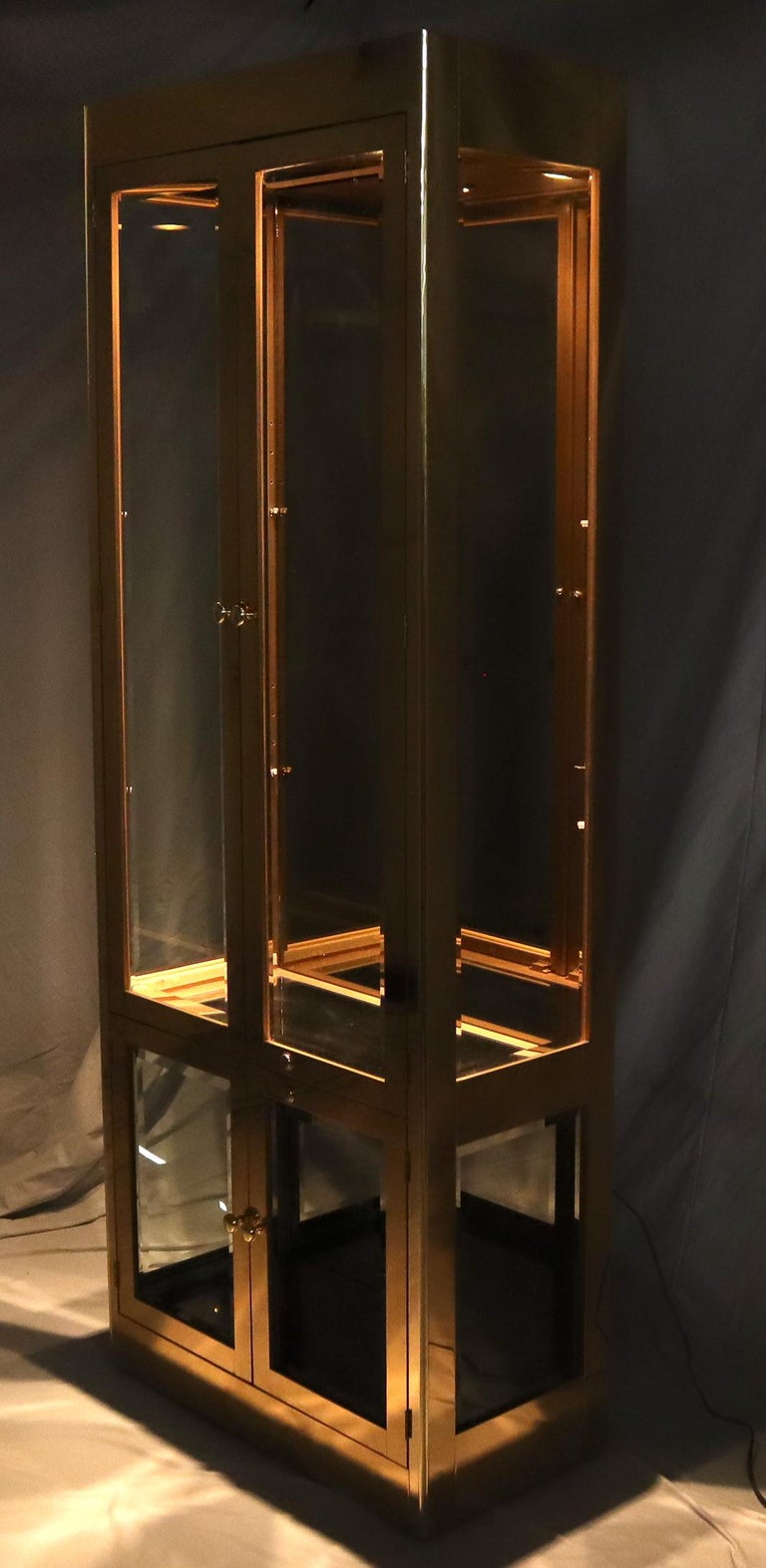Mid-Century Modern brass and glass tall display cabinet showcase vitrine by Mastercraft.