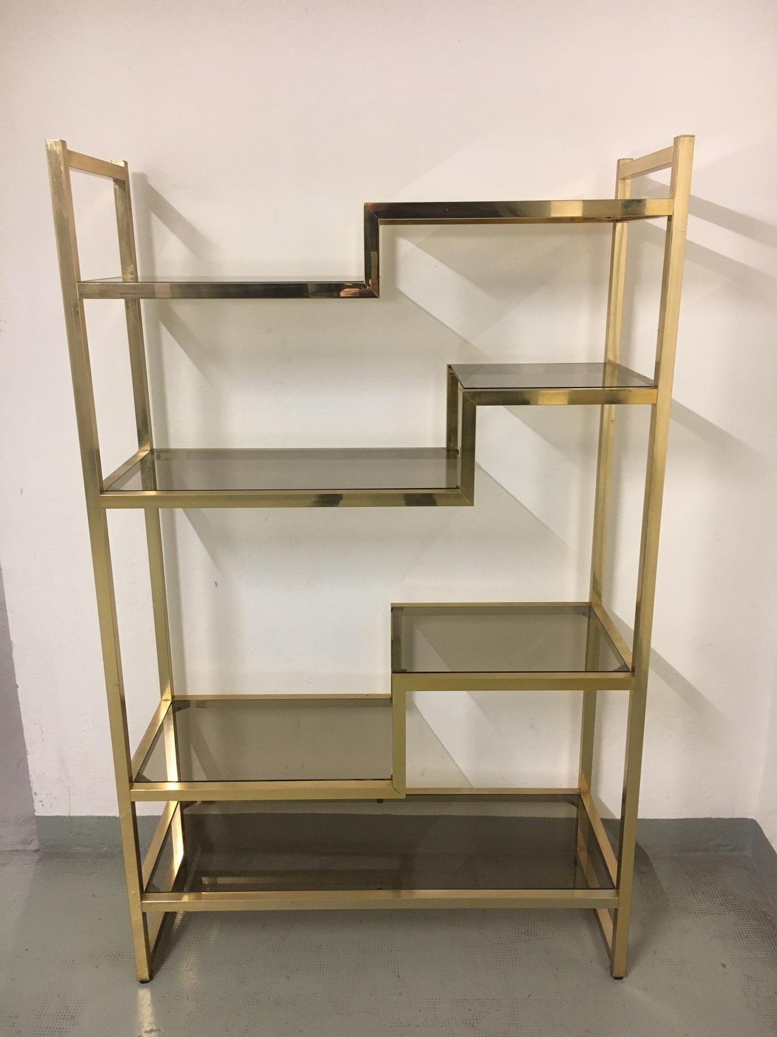 Vintage brass and smoked glass shelving / étagère in the style of Romeo Rega and Willy Rizzo shelves from the same period, made in Italy ca. 1970s.
Very good condition, highly decorative.
 