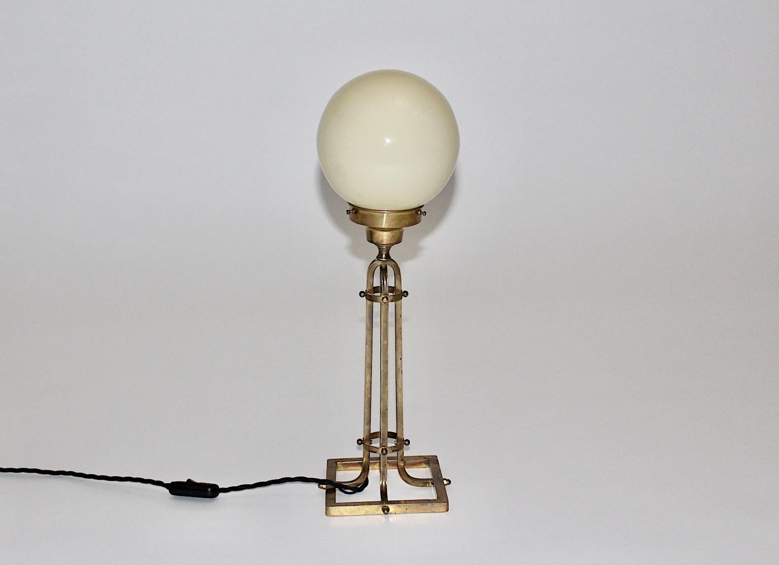 Brass glass vintage table lamp style Vienna Secession, which was made 1950s, Austria.
The brass construction shows beautiful brass patina, while the ivory colored glass shade is in very good condition.
One E 27 socket and on/off switch
Very good