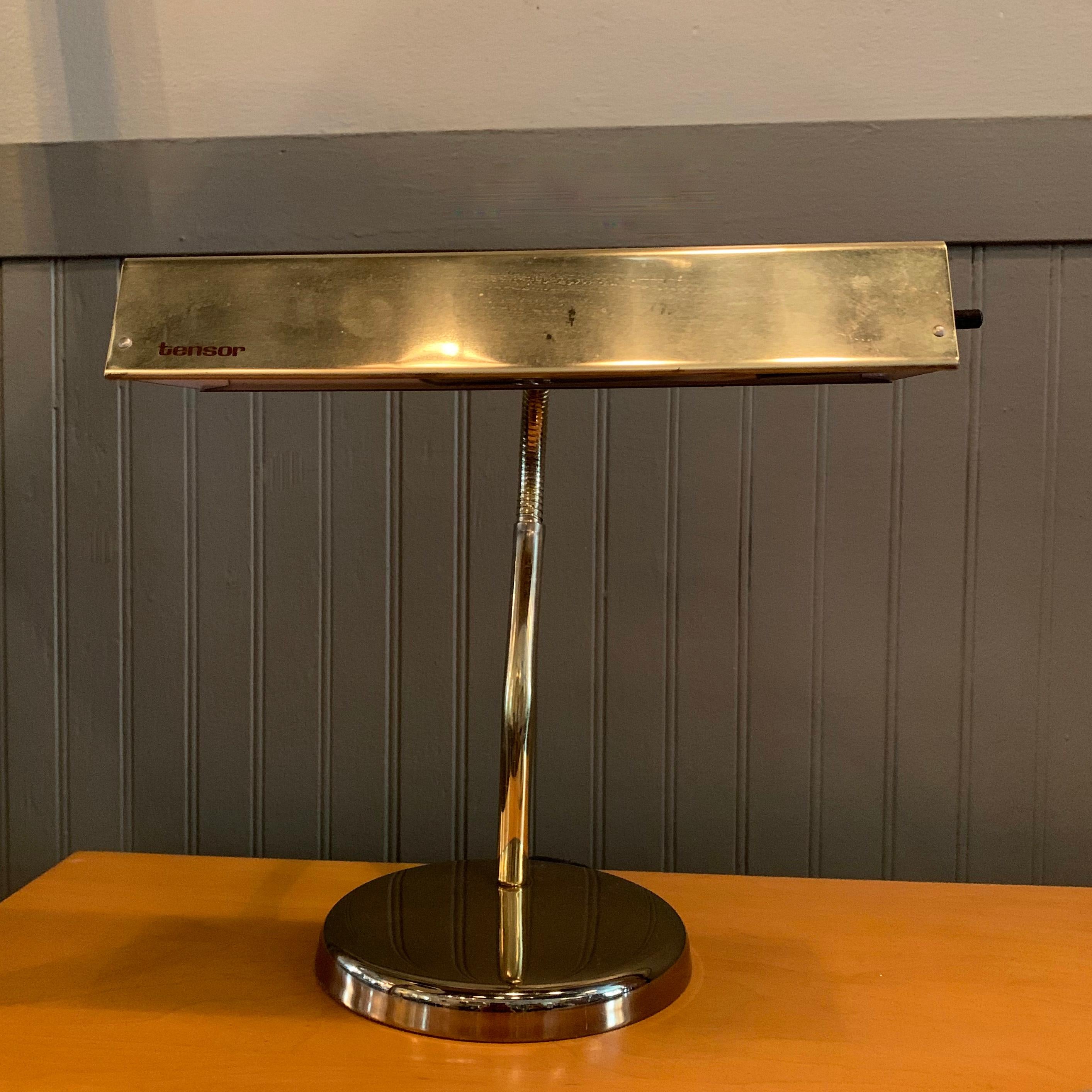 Mid-Century Modern, bass, desk lamp by Tensor features a, malleable, adjustable, gooseneck with 6 inch diameter base. The lamp accepts one medium socket bulb up to 75 watts.
