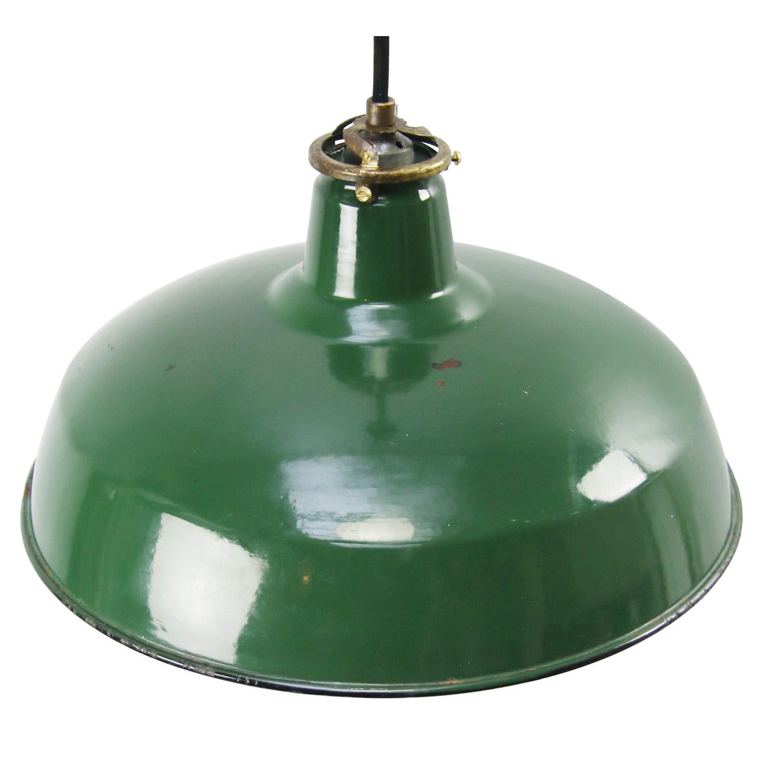 Vintage American Industrial pendant made of green enamel with brass top.
white interior

Weight: 1.00 kg / 2.2 lb

Priced per individual item. All lamps have been made suitable by international standards for incandescent light bulbs,