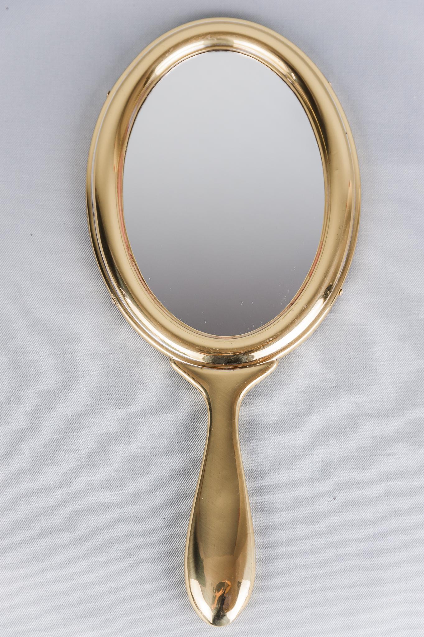 Brass hand mirror circa 1920s by Argentor
Polished.
 