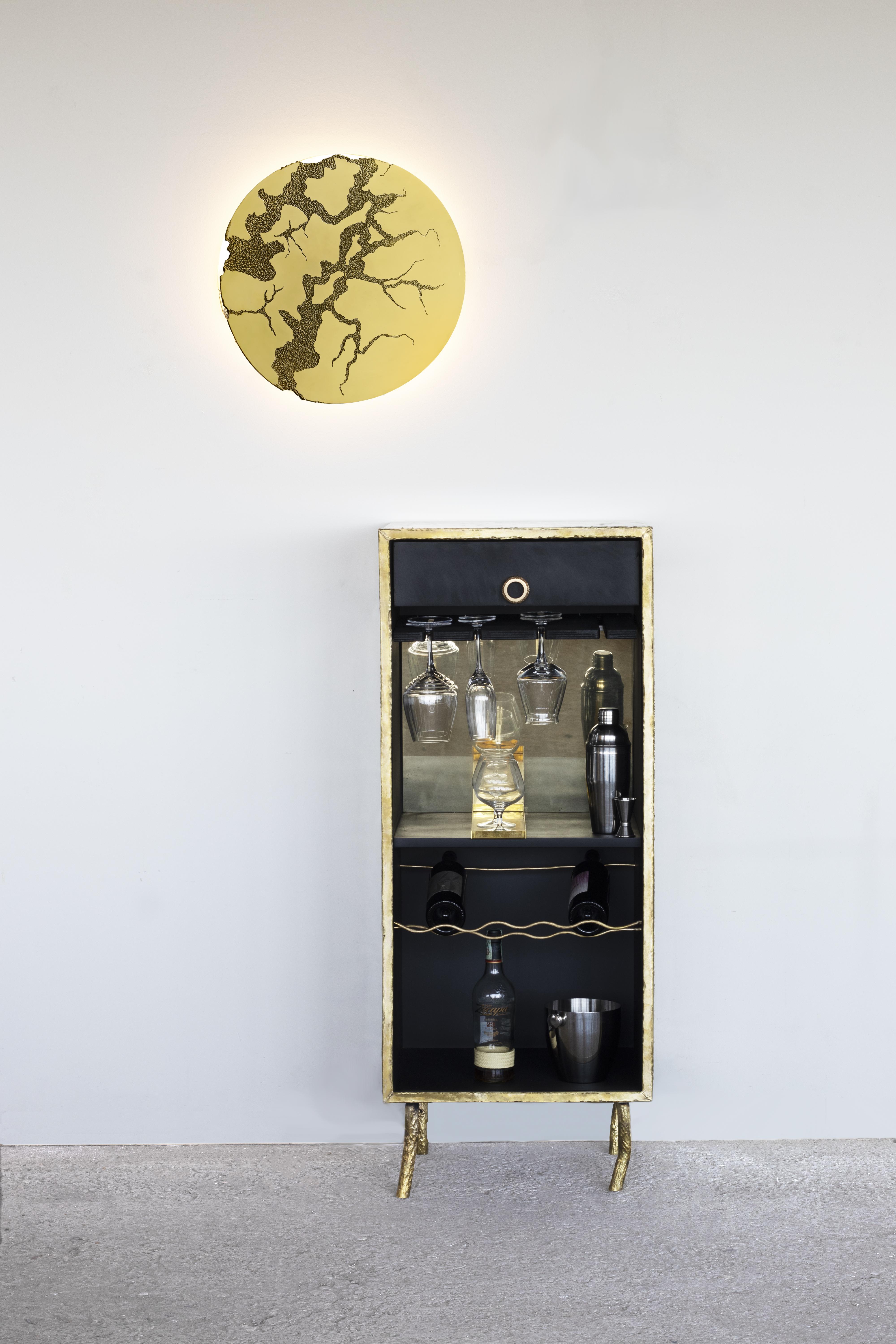 Brass hand-sculpted Dry Bar by Samuel Costantini
Entirely handmade by the artist
Title: Gate Dry Bar
Edition 9 + 1 AP
Measures: W50 cm x D 40 cm x H 150 cm.

This cabinet made of brass, with a wooden interior, is inspired by the majestic and