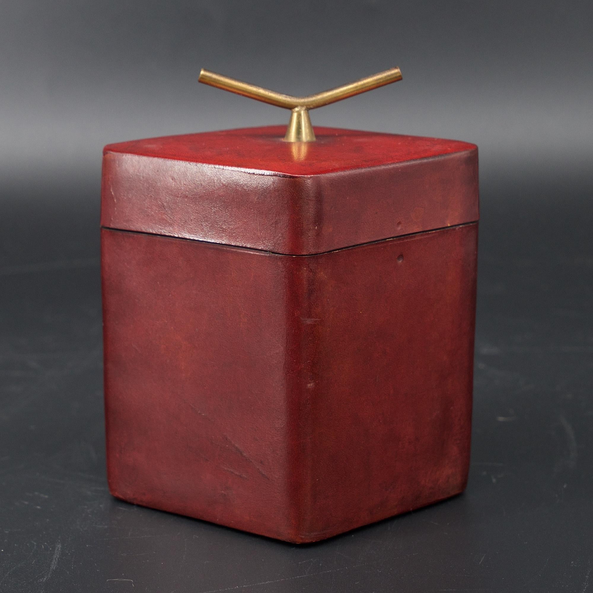Wonderful small leather wrapped box with brass handle, for trinkets, etc.