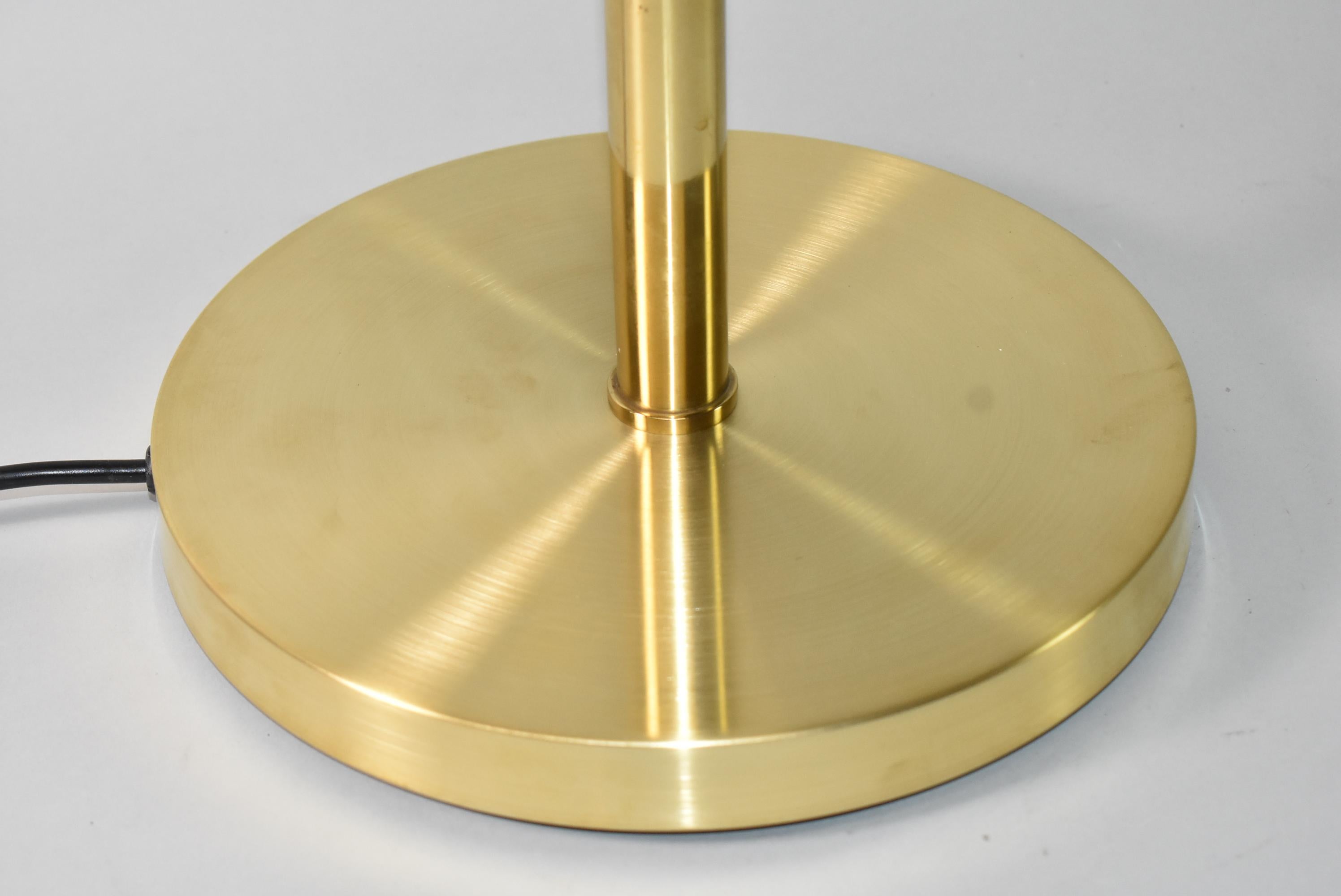 Mid-century modern brass floor lamp by Hansen. Adjustable from 42