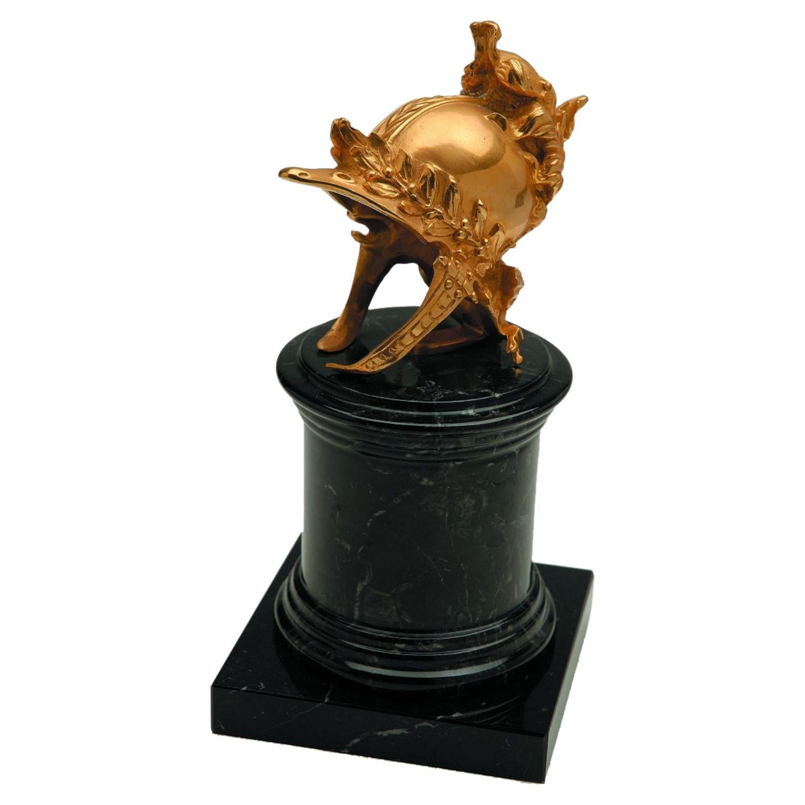Arthur decorative natural brass helm with black marble base For Sale