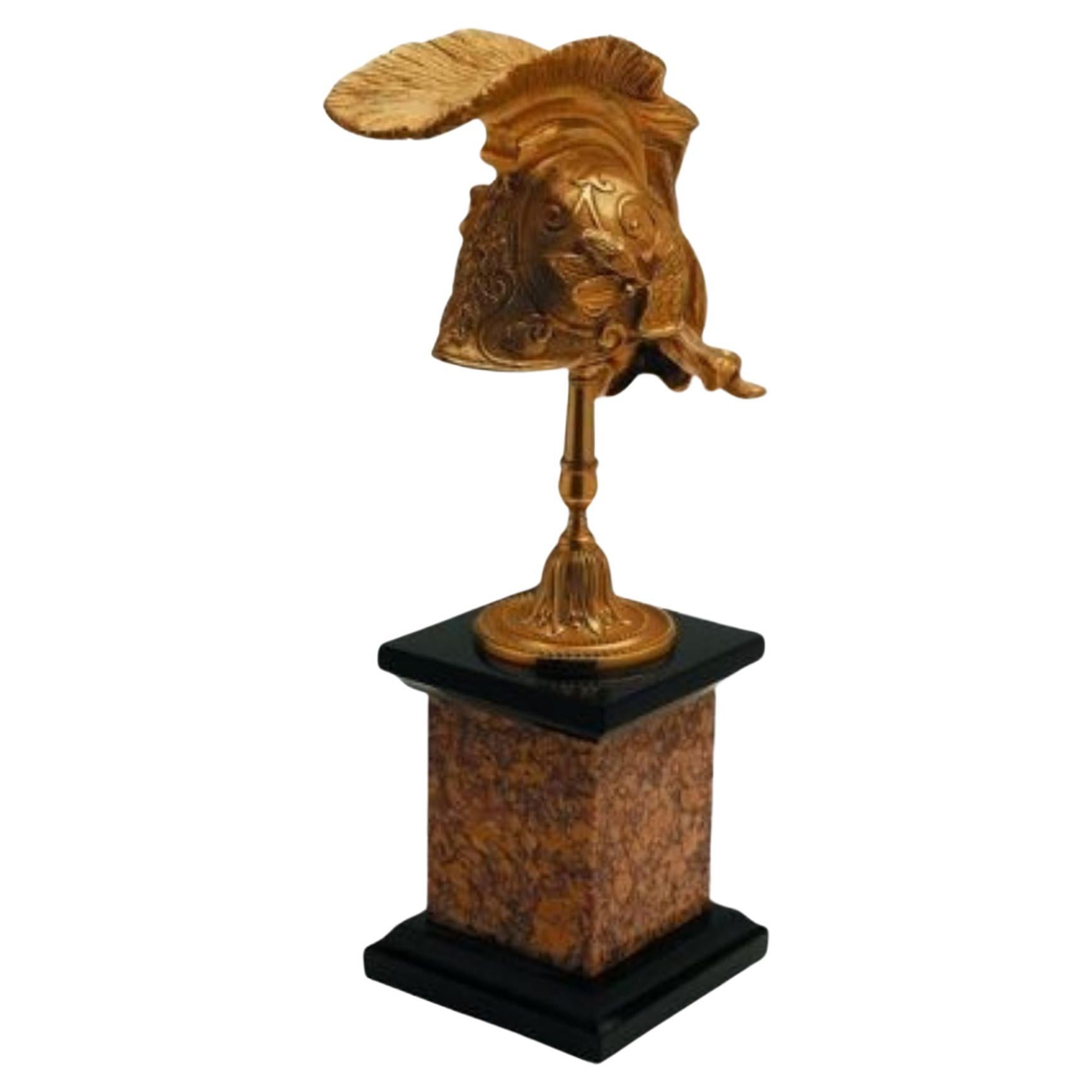 Arthur decorative natural brass helm with black and brown marble base For Sale