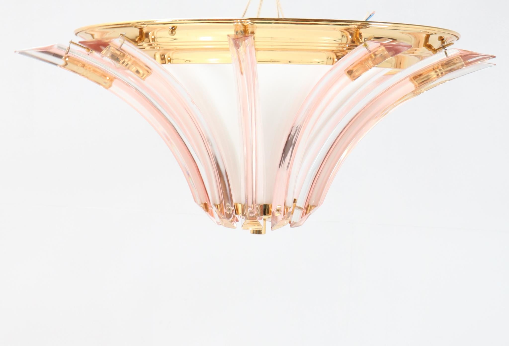Magnificent and ultra rare Hollywood Regency flush mount ceiling light.
Striking Italian design from the 1980s.
Brass frame with original milk glass shade and Murano glass elements.
Please note that we have three flush mount ceiling lights in