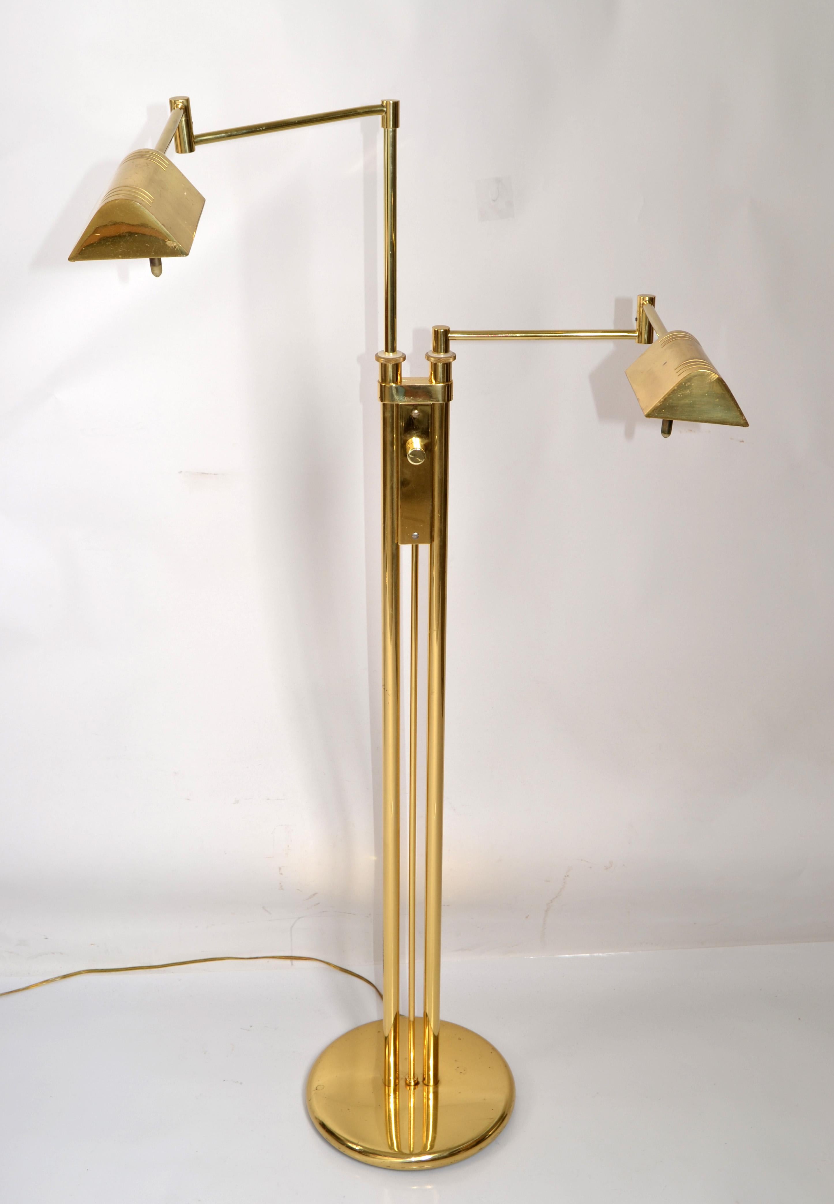 Two Arm polished Brass Holtkoetter Leuchten Floor Lamp (Holkoetter Leuchten of Germany) designed in the Style of the Bauhaus Period and made in circa Beginning of 1980s.  
Reading pharmacy lamp with swing arm floor lamps next to Your favorite