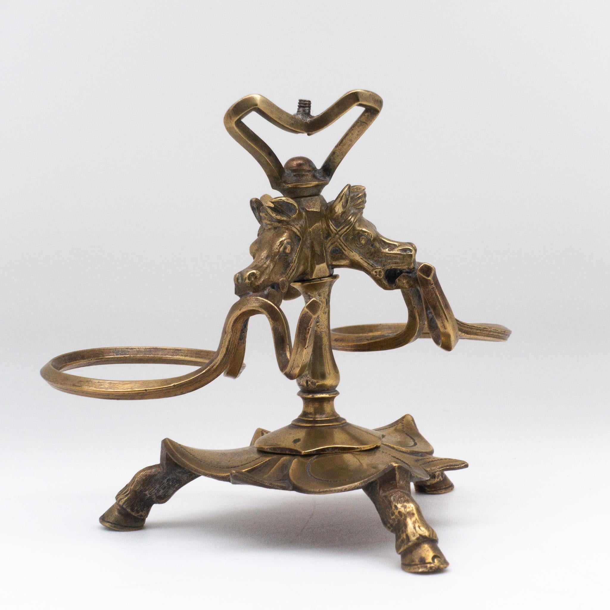 Brass horse inkwell with hoofed feet.