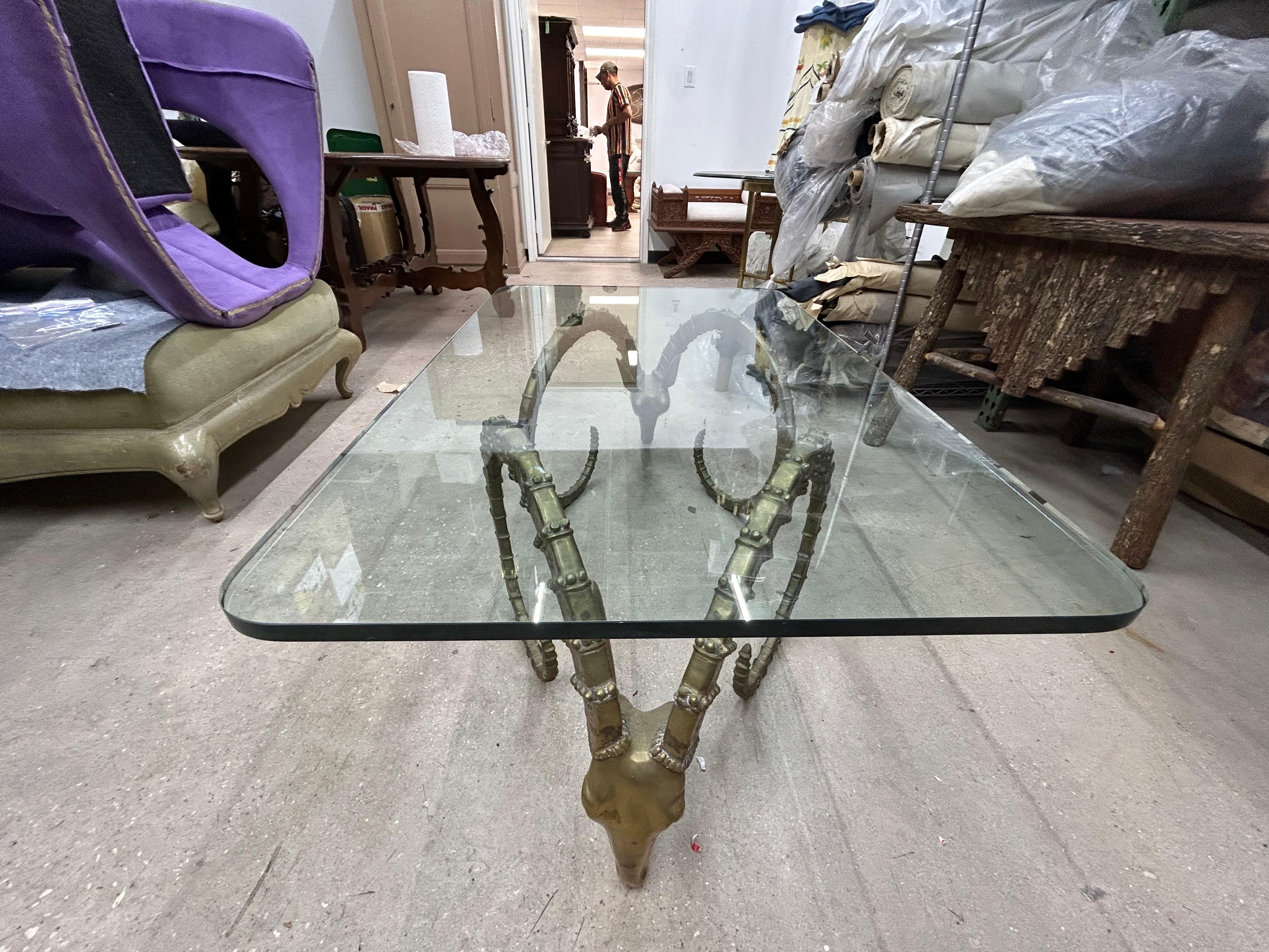 Brass Ibex Head Coffee Table After Alain Chervet.
Offered is a great French mid century / Hollywood Regency brass Ibex head or ram's head cocktail table with a 3/4 inch glass top.
This Alain Chervet inspired well detailed table would look well in a
