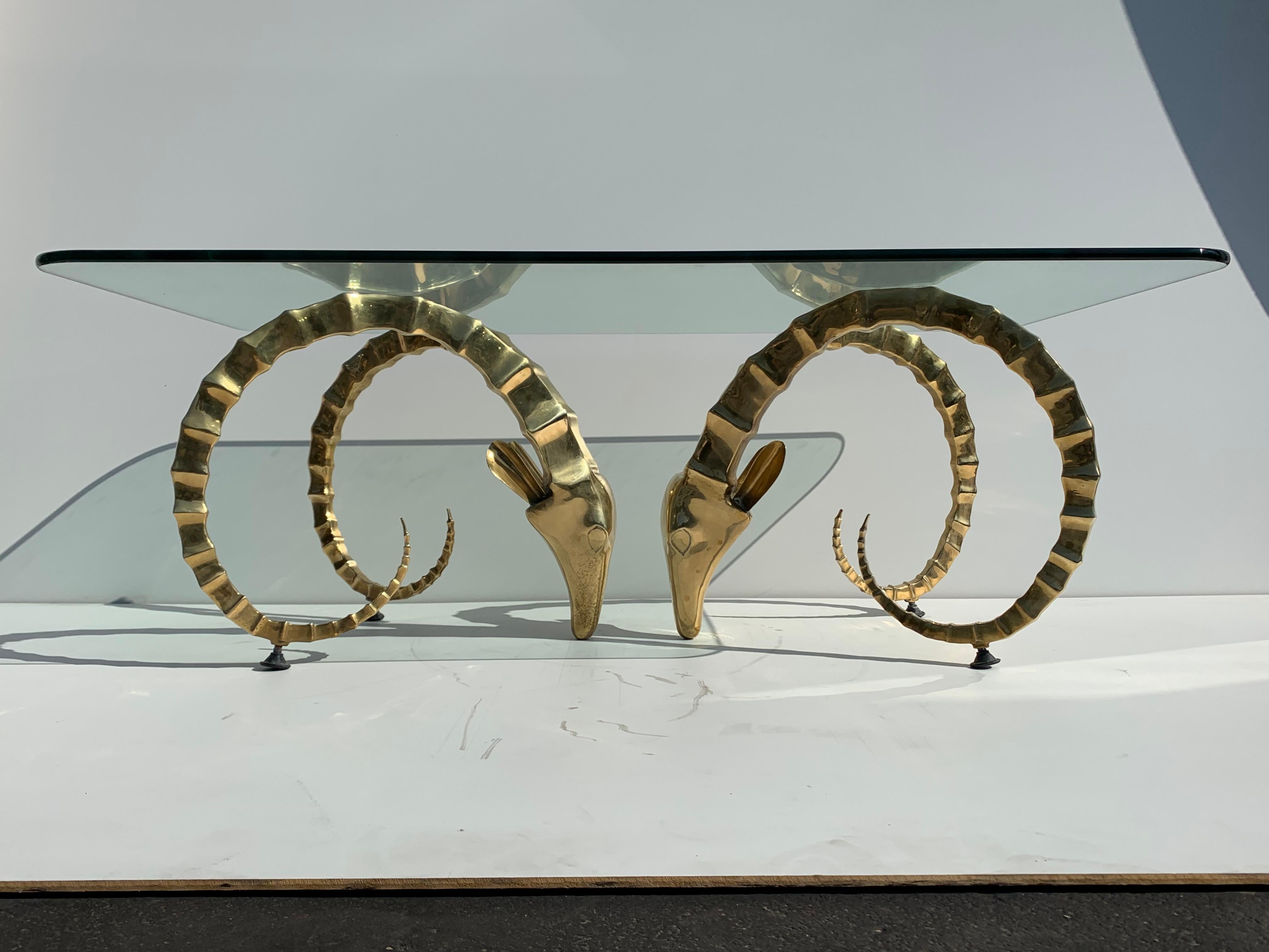 Brass ibex or ram coffee table in the style of Alain Chervet. Each base is 17.5