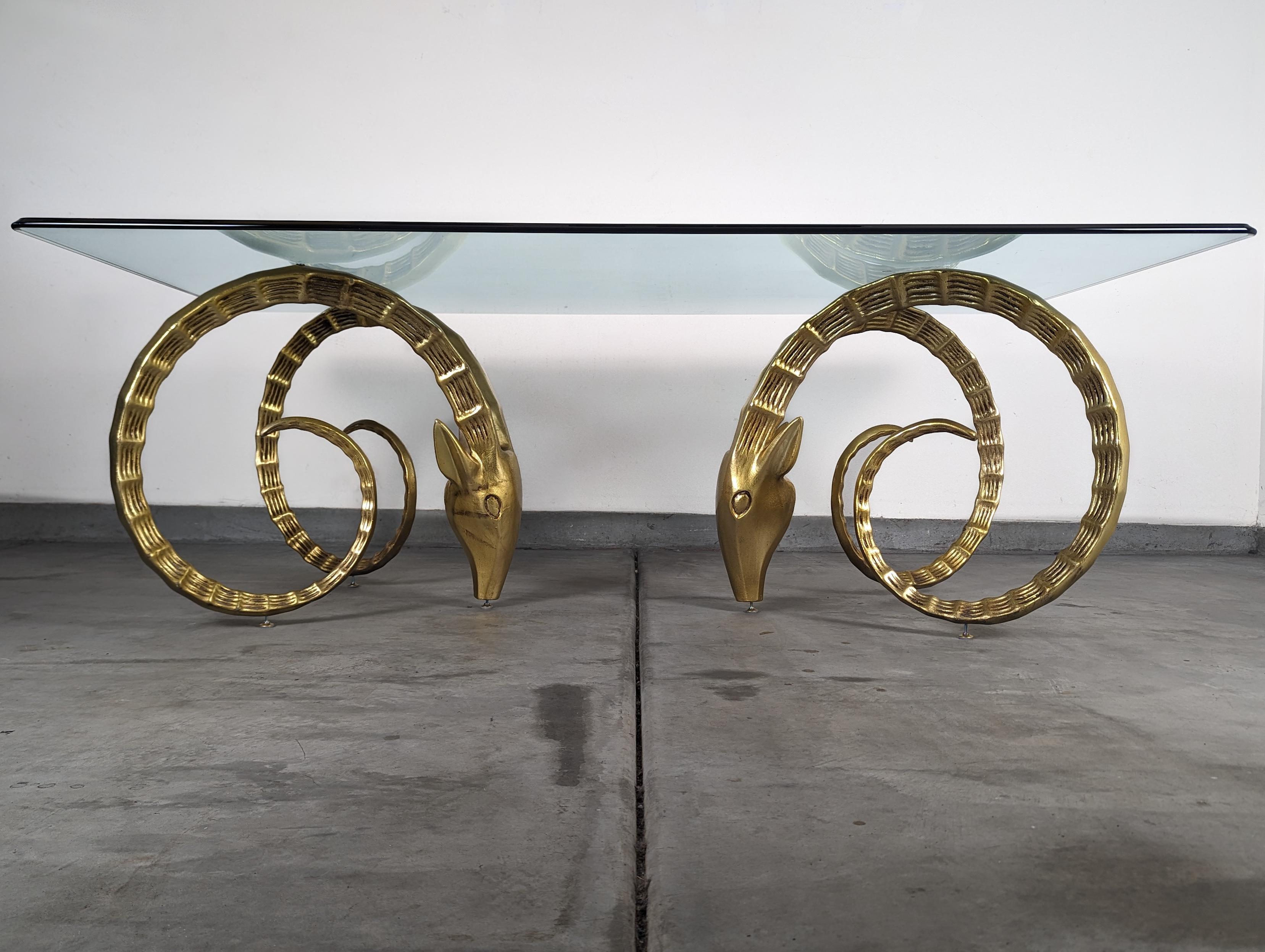 Discover the epitome of vintage luxury with this striking Ibex Dining Table, attributed to the renowned designer Alain Chervet. A treasure from the 1970s, this table is a testament to the opulence and daring design of the Hollywood Regency period,