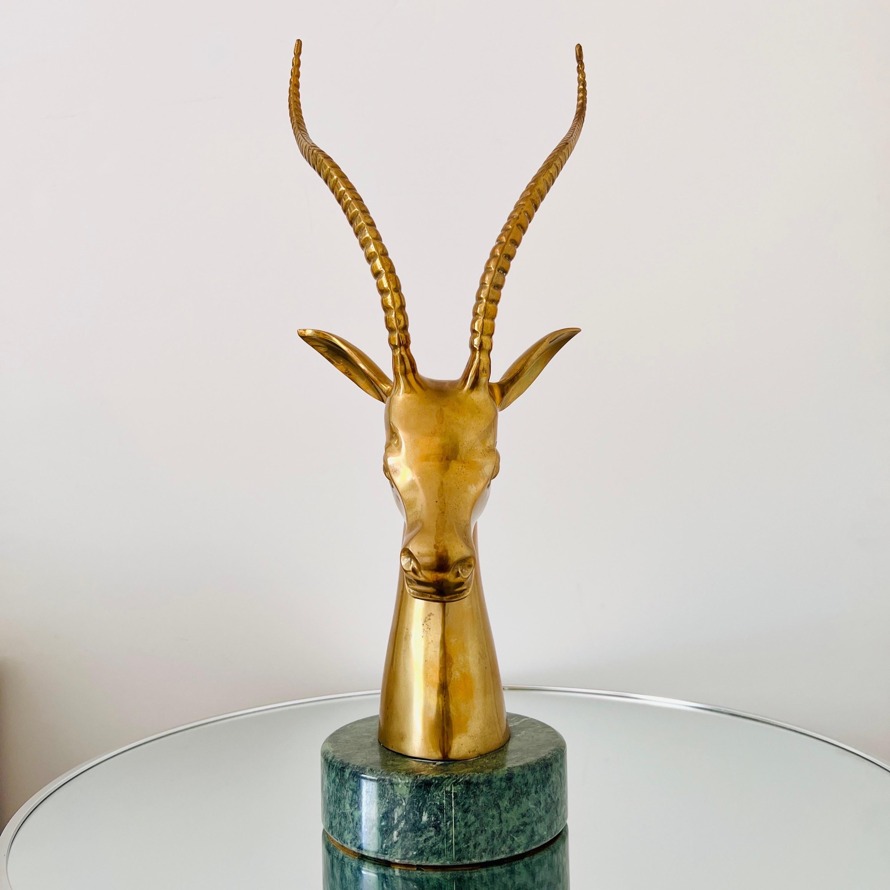 1970s Vintage sculpture features a stylized Kudu Antelope or Ibex in brass over an exotic Verde Guatemala marble base. The sculpture features hand forged designs throughout with striking details from every angle. Marble base has hand polished finish