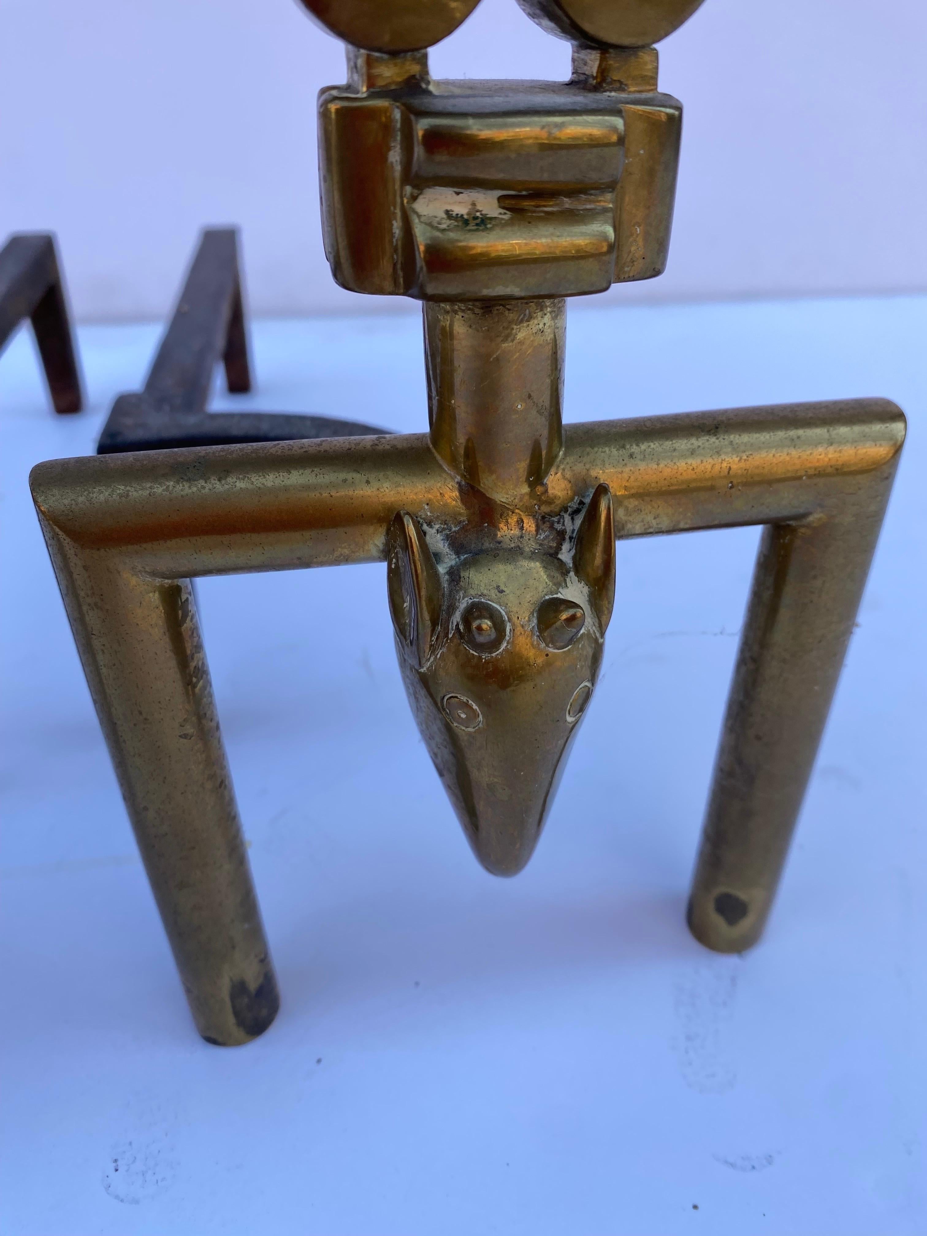 Pair of solid brass Andirons with animal heads at the bottom, Indian Design? Not sure of the design. They are very well made and good looking!