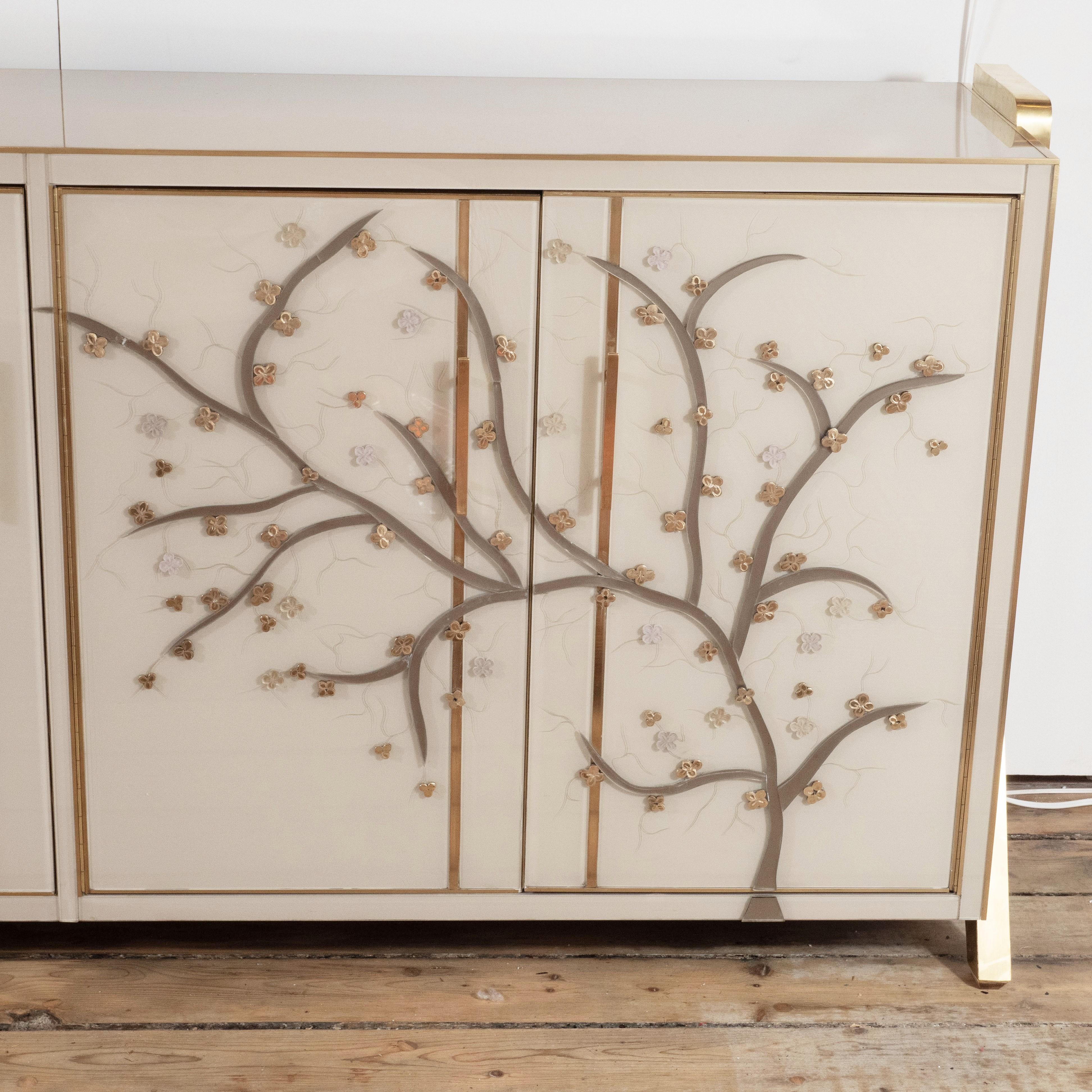One of a kind pair of sideboards handmade in Venice, Italy by a master artisan and artist. Wooden frame is covered in Ivory hand painted Murano glass panels with brass inlays. Handmade and handcut multicolored glass flowers in pearl, lavender and
