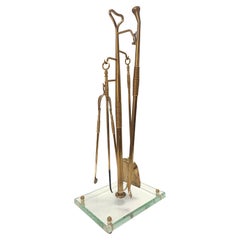 Juego de utensilios para chimenea de latón, hierro y vidrio grueso attr. a Fontana Arte, Italia