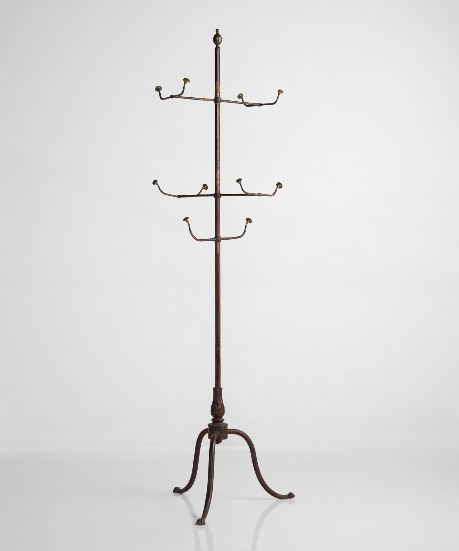 Brass and iron coat stand, Italy, circa 1900.

With original paint. Iron rod with cast detailing, and brass finial and hangers.

  