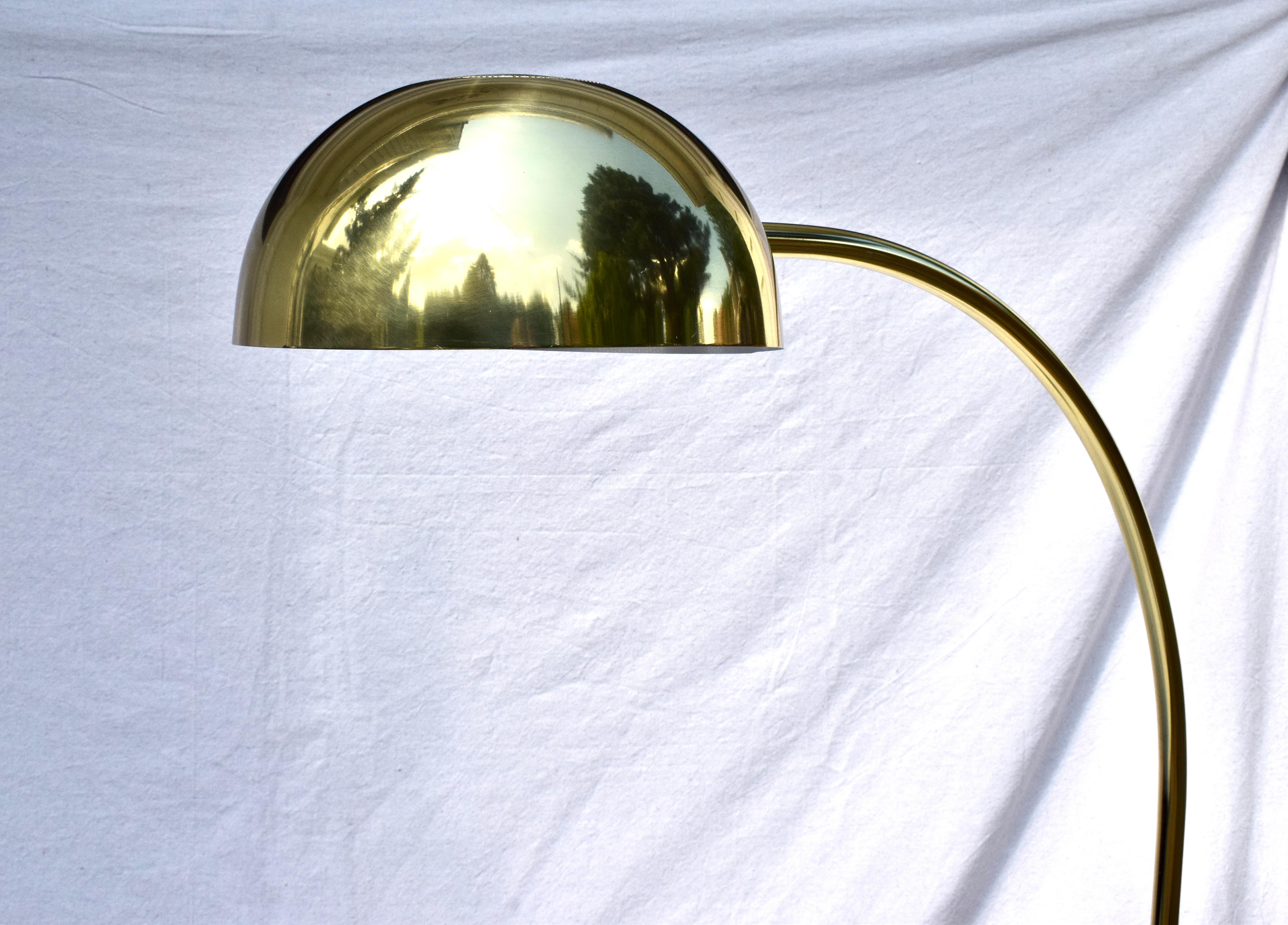 Post Modern Brass Arc Floor Lamp 1970's Italy. Reasonable in size with pivoting dome weighted brass circular base and subtly curved frame. Additional Dimensions: Dome 12