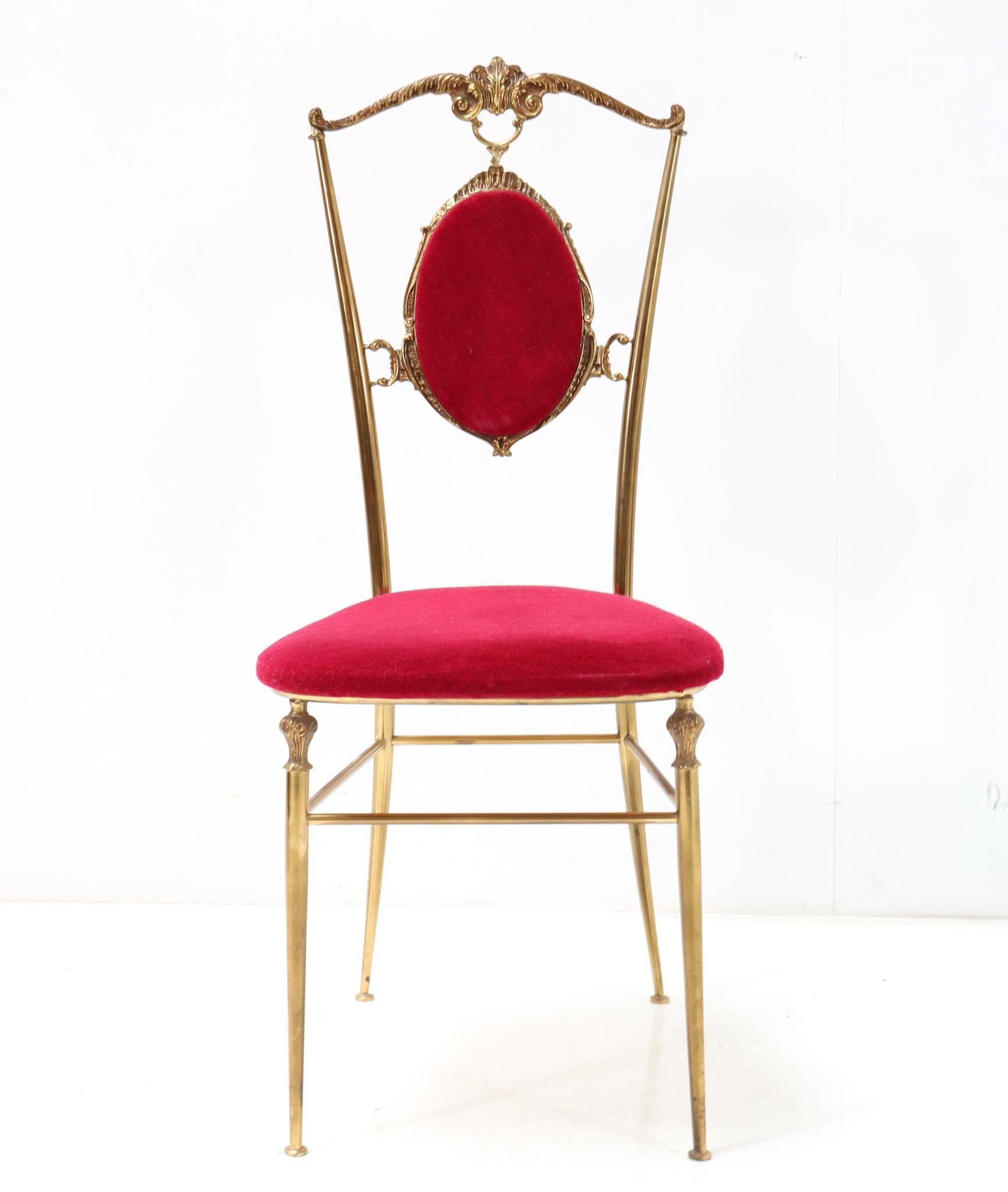 Stunning and elegant Mid-Century Modern side chair.
Design by Chiavari.
Striking Italian design from the 1960s.
Solid brass frame with original red velvet seat and back.
In good original condition with minor wear consistent with age and use,
