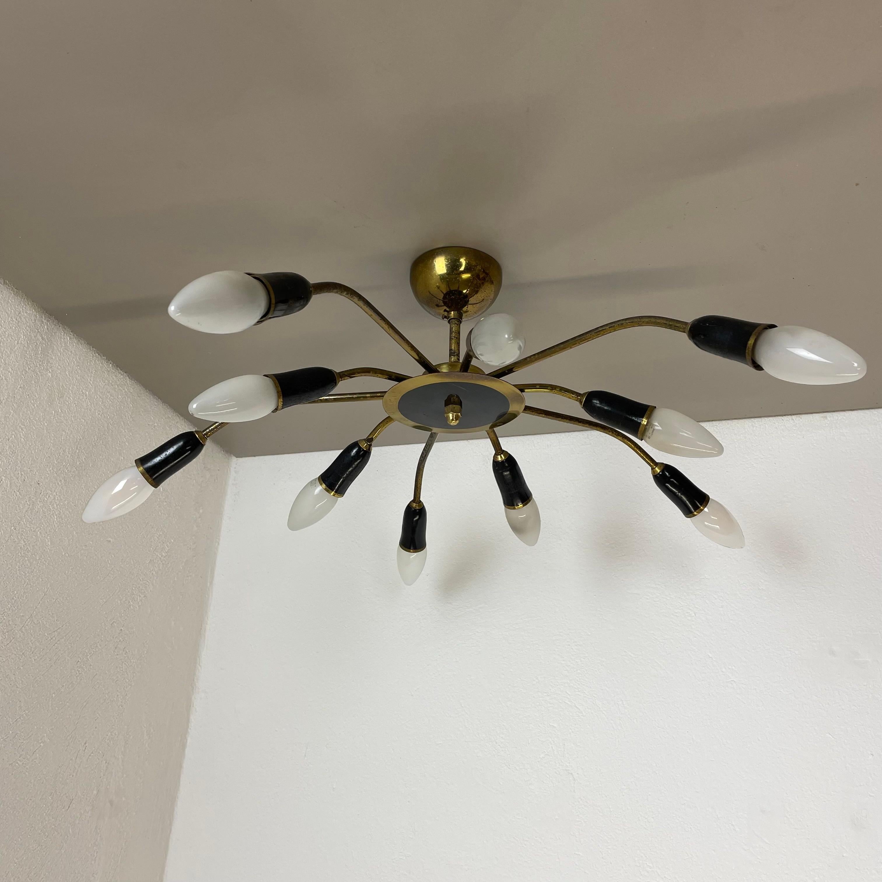 Article:

Ceiling light


Producer:

Origin Italy 
in the manner of Stilnovo, Gio Ponti



Age:

1950s



This modernist light was produced in Italy in the 1950s. It is made from solid metal brass with brass with 10 light arm elements. the light