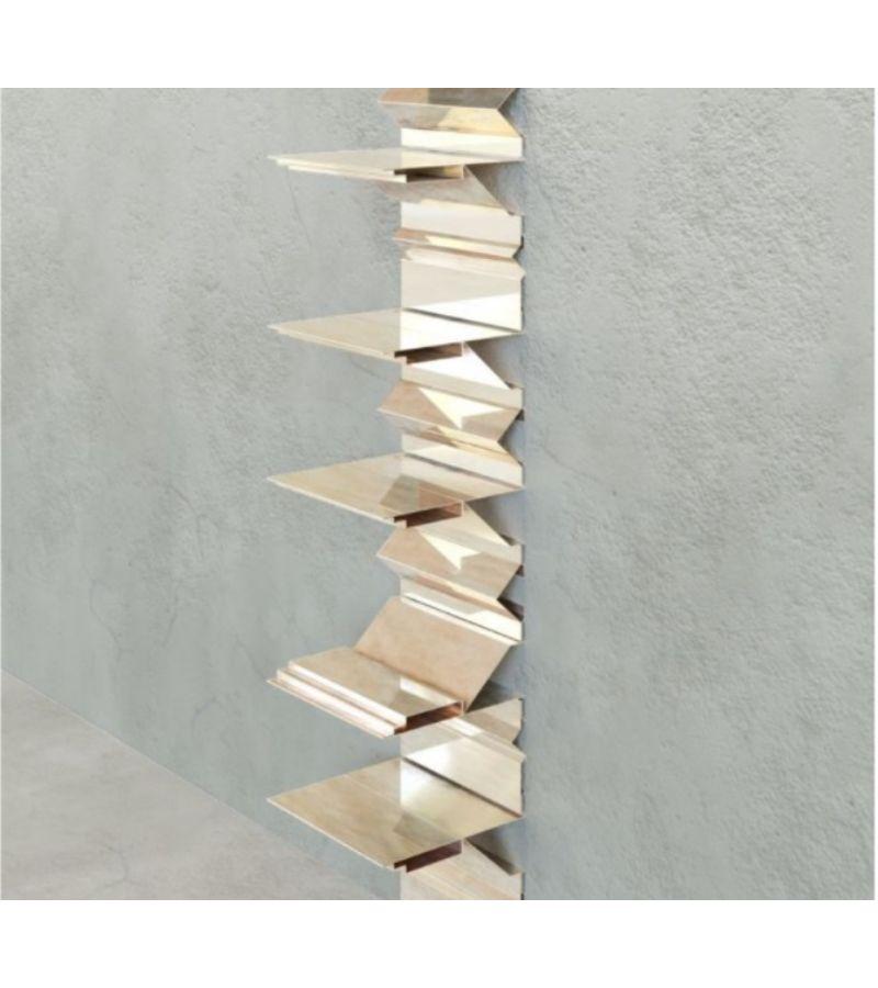 Brass item 4 turning points bookcase shelf by Scattered Disc Objects 
Limited Edition 
Dimensions: D 28 x W 33 x H 170 cm 
Material: Brass sheet.
Technique: Folded brass sheet, modular, wall-mounted with a back profile in solid brass.
Available
