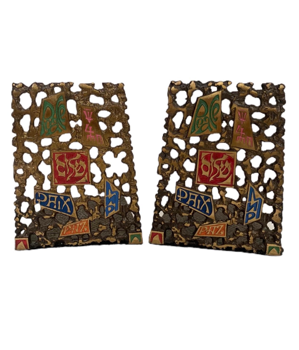 Beautiful pair of Midcentury modern brass Shalom Judaica bookends. Brass with lovely patina with color enameled accents. Felt under the stands for use on multiple surfaces, signed “Tree of Life” on the back.