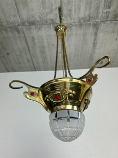 Brass jugendstil chandelier with red crystals