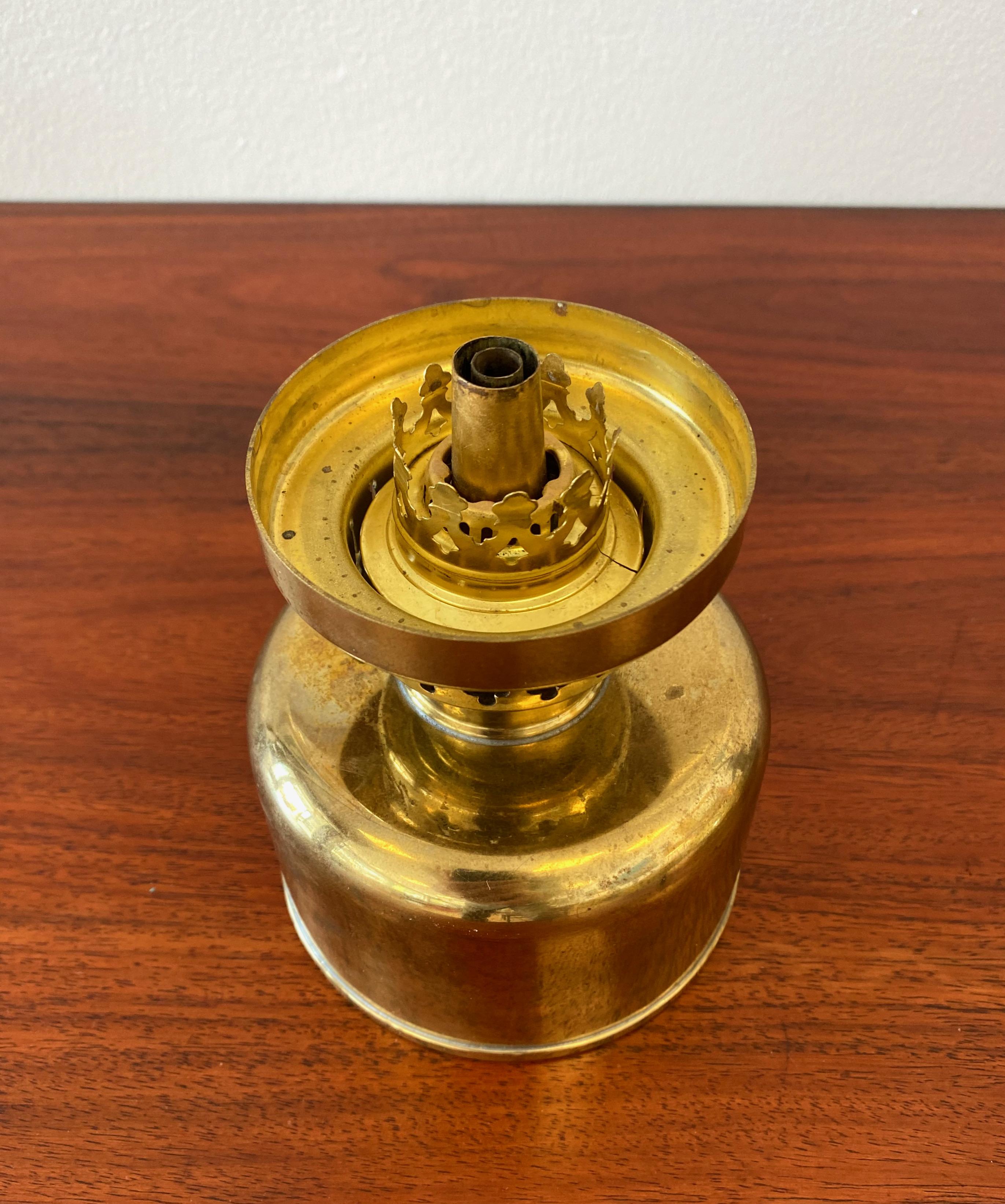 The lamp is in very good order without any chips to the glass parts. Some patina to the brass but no dents or other major marks.