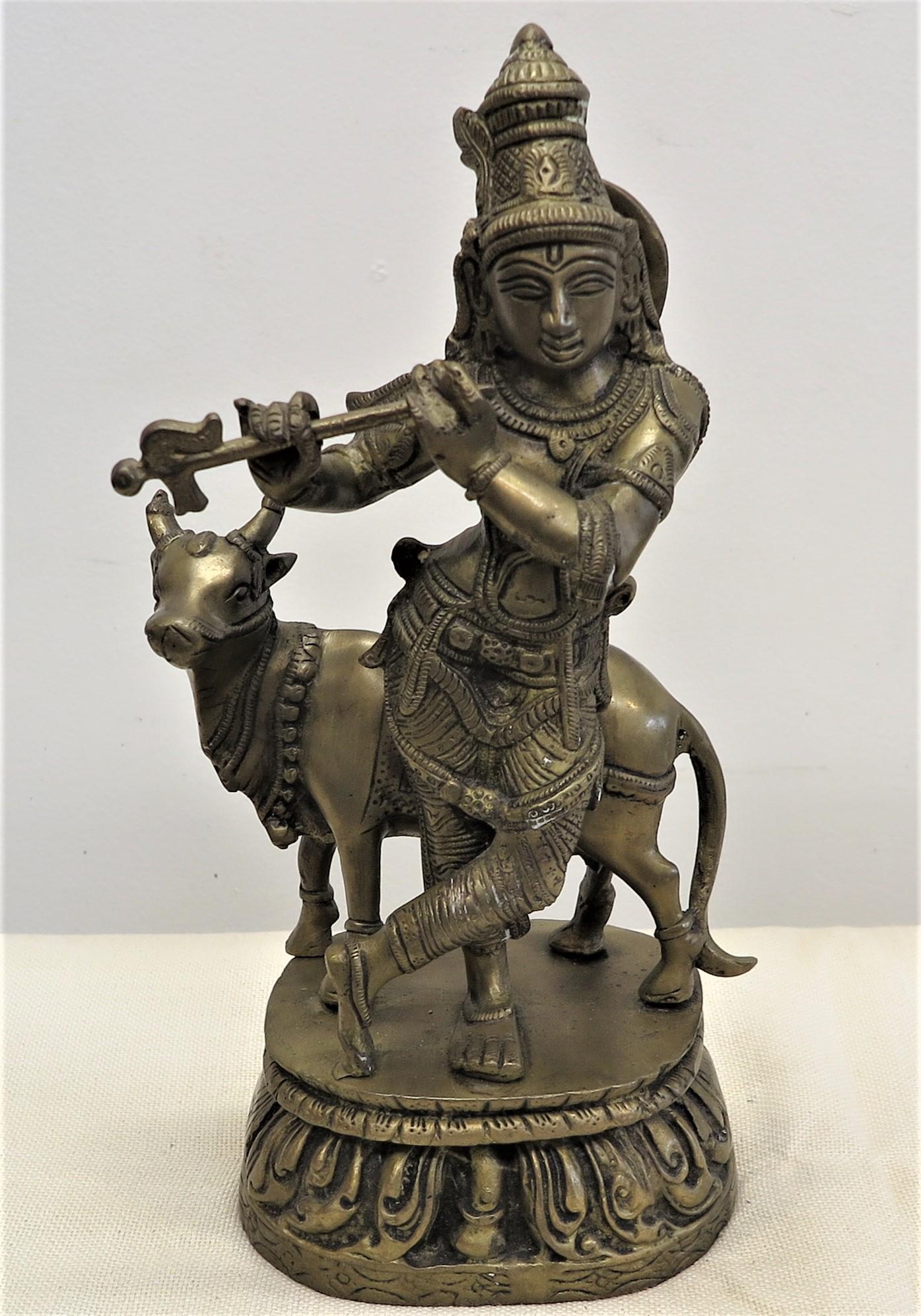 Wonderful brass statue of Krishna with Nandi. Brass Krishna with Nandi Statue vintage handmade using lost wax technique for casting. Krishna's mount is Nandi. Nandi the cow represents divine bliss, joy, pleasure, cheerful, jovial, delightful,