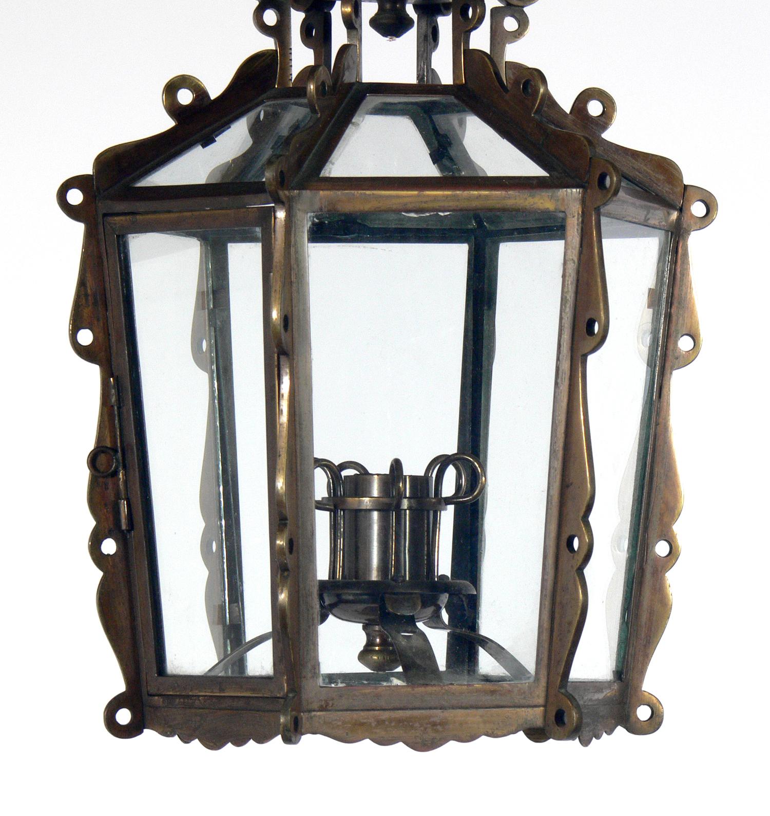 Elegant brass lantern or pendant light, in the manner of Tommi Parzinger, American, circa 1940s. Perfect size for a foyer or hallway. Retains warm original patina. It has been rewired and is ready to mount.