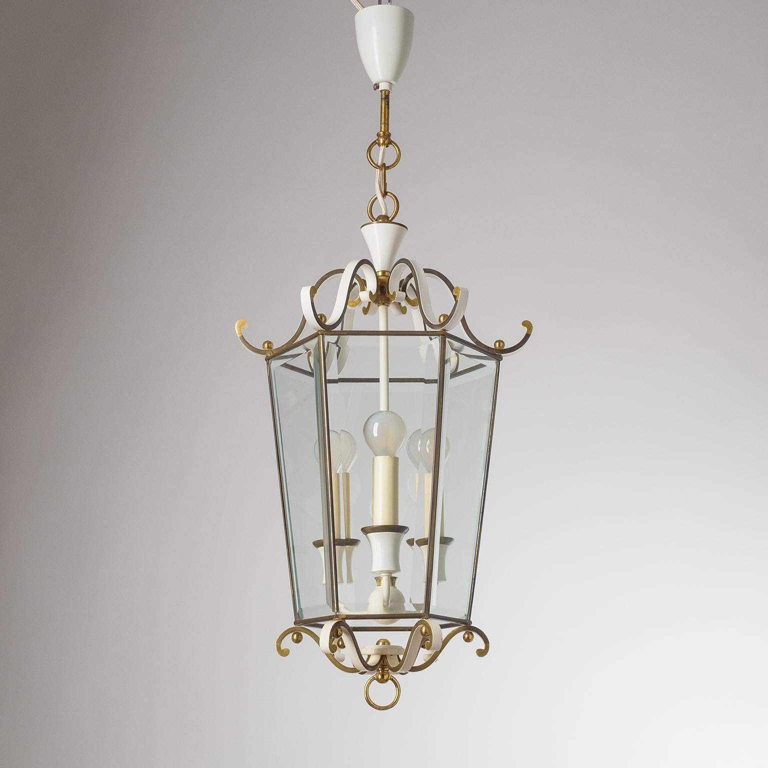 Lyrical mid-century brass lantern with faceted glass. Very intricate design with a solid hexagonal brass structure, which is partially enameled in white, and six faceted glass elements. Three original E14 sockets with new wiring.